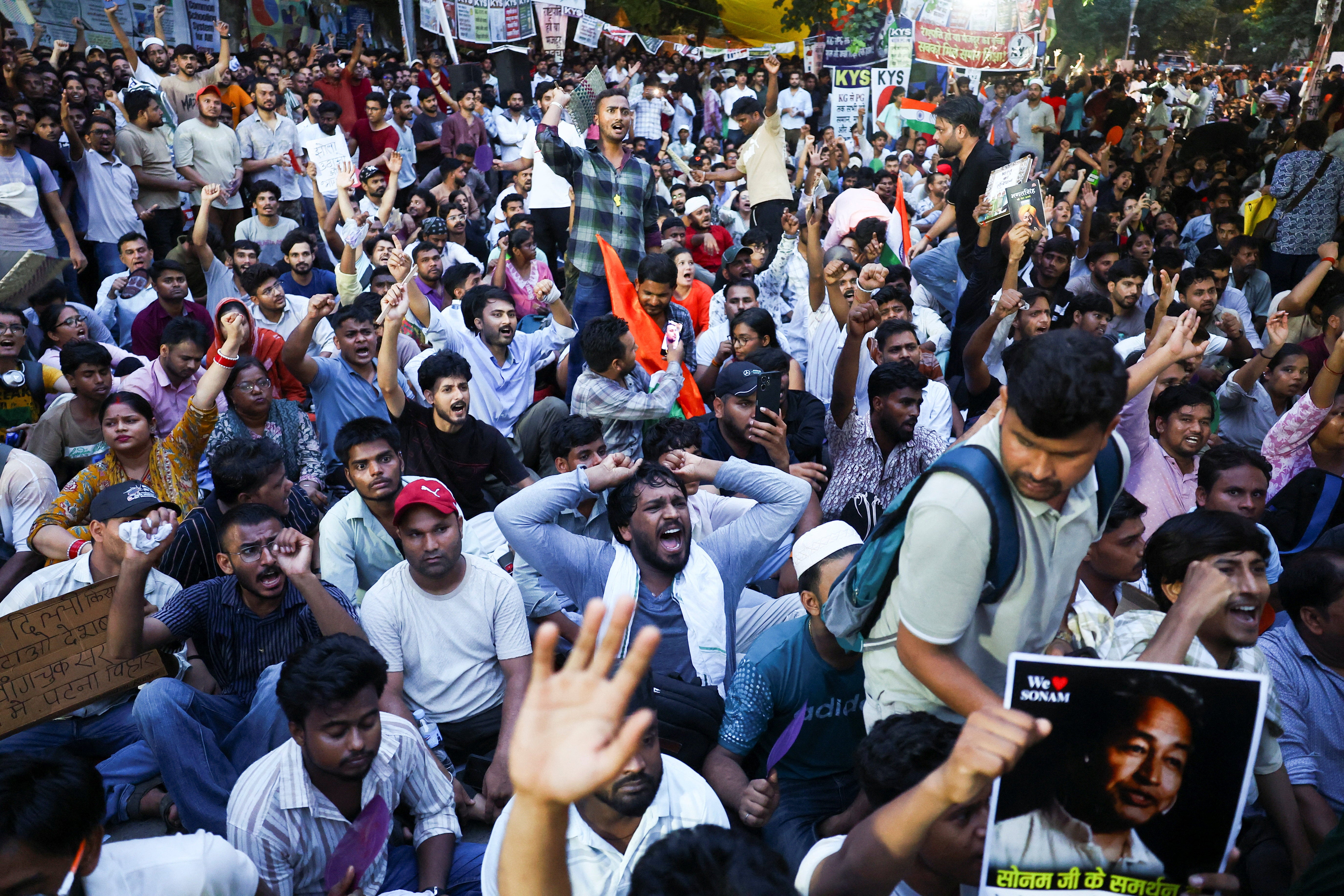 Supporters of the Cockroach Janta Party chant slogans as they gather at Jantar Mantar in Delhi