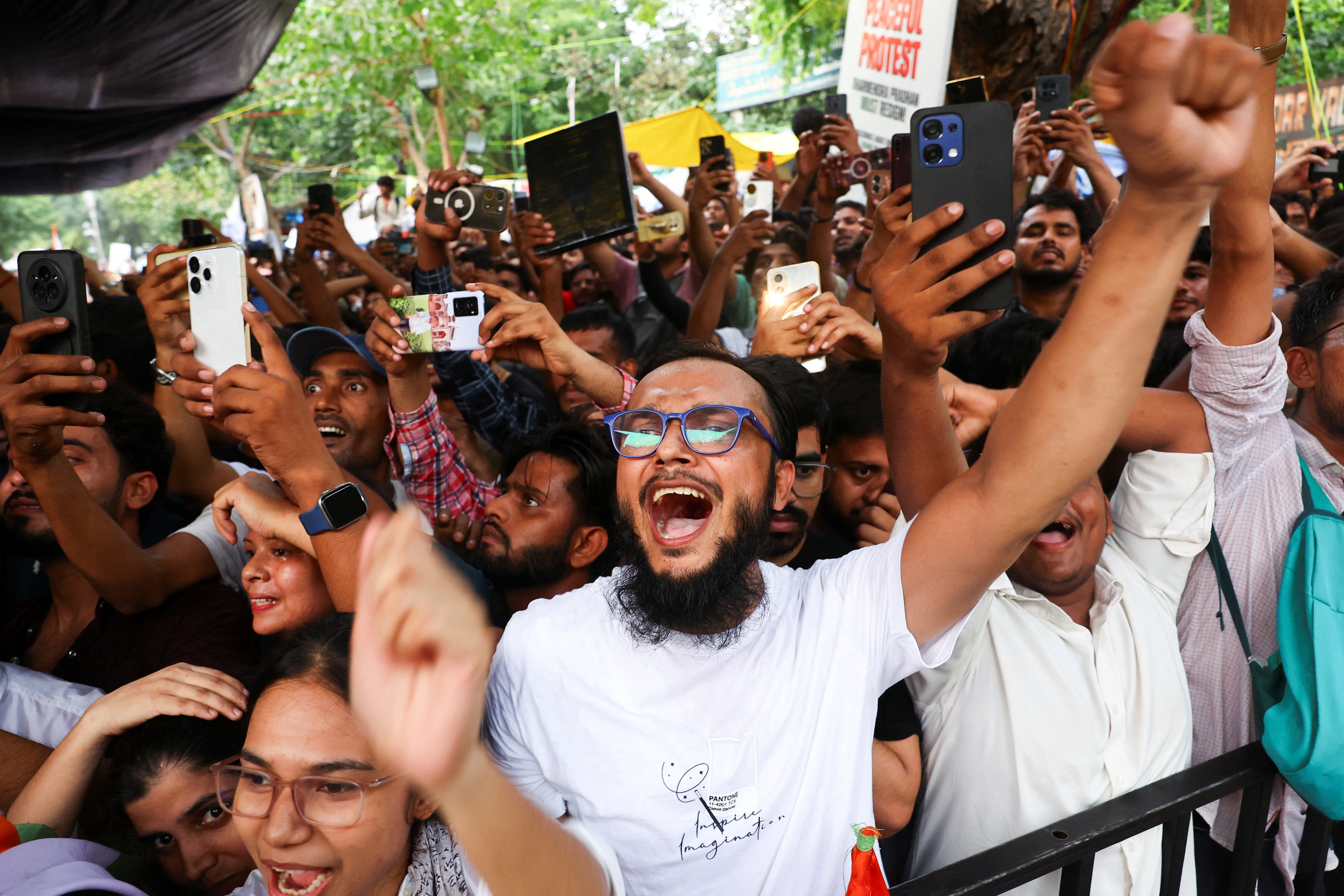 Supporters of the Cockroach Janta Party shout slogans after activist Sonam Wangchuk is forcibly taken away by police on Saturday