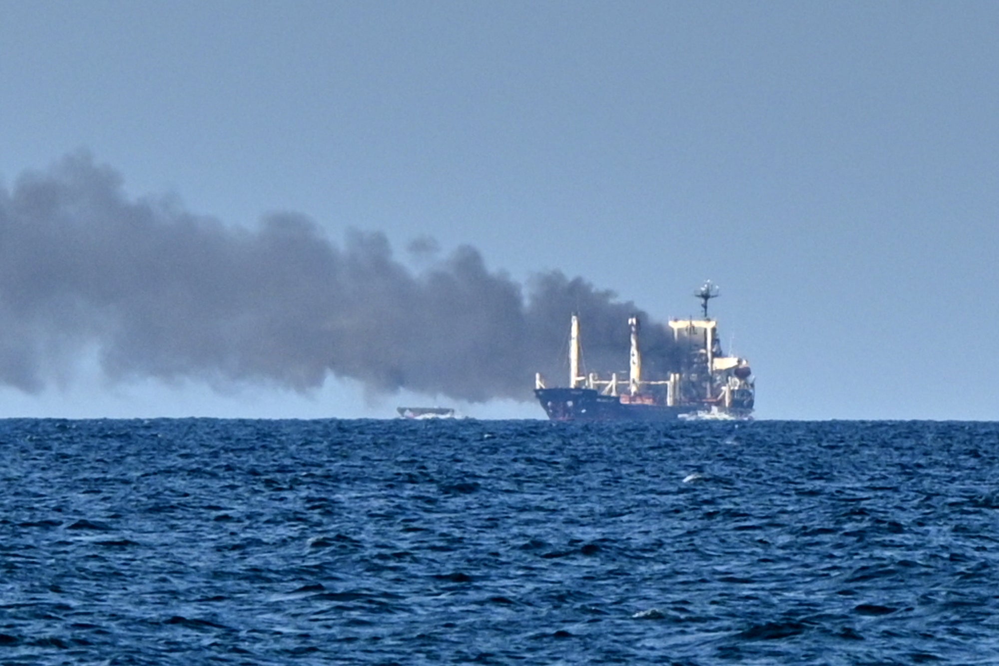 Smoke rises from the grain carrier Golden Leo under the Guinea-Bissau flag after Russian missile strike in the Black Sea close to Odesa, Ukraine
