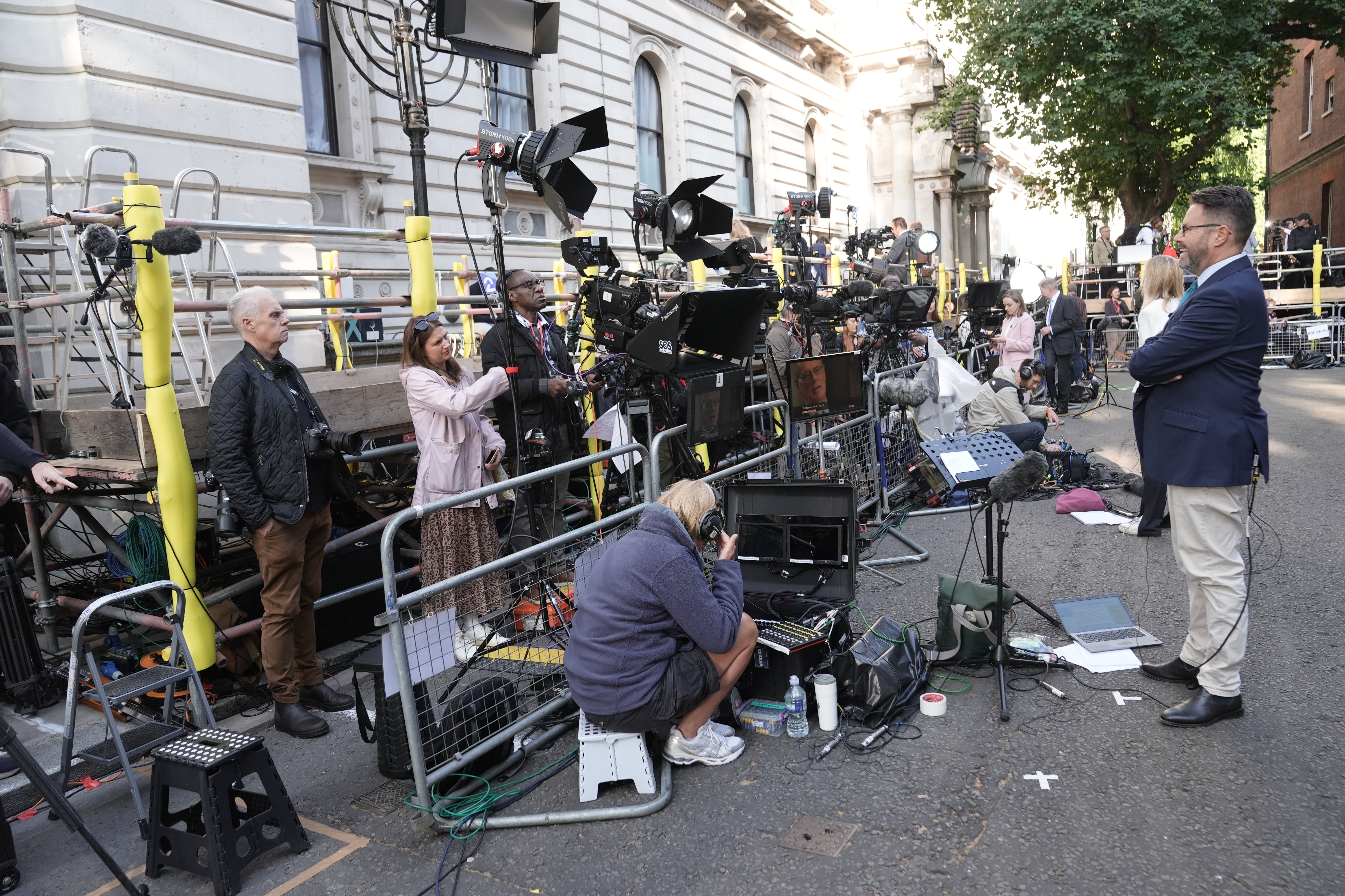 Members of the media gather on Downing Street ahead of Andy Burnham being confirmed as the new prime minister