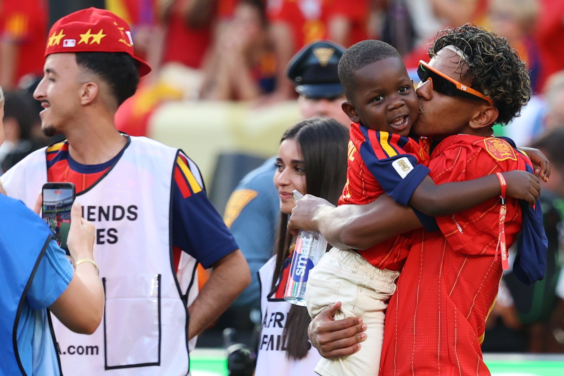 Spain's Lamine Yamal (19) kisses Keyne, his younger brother after Spain win the World Cup final (AP)