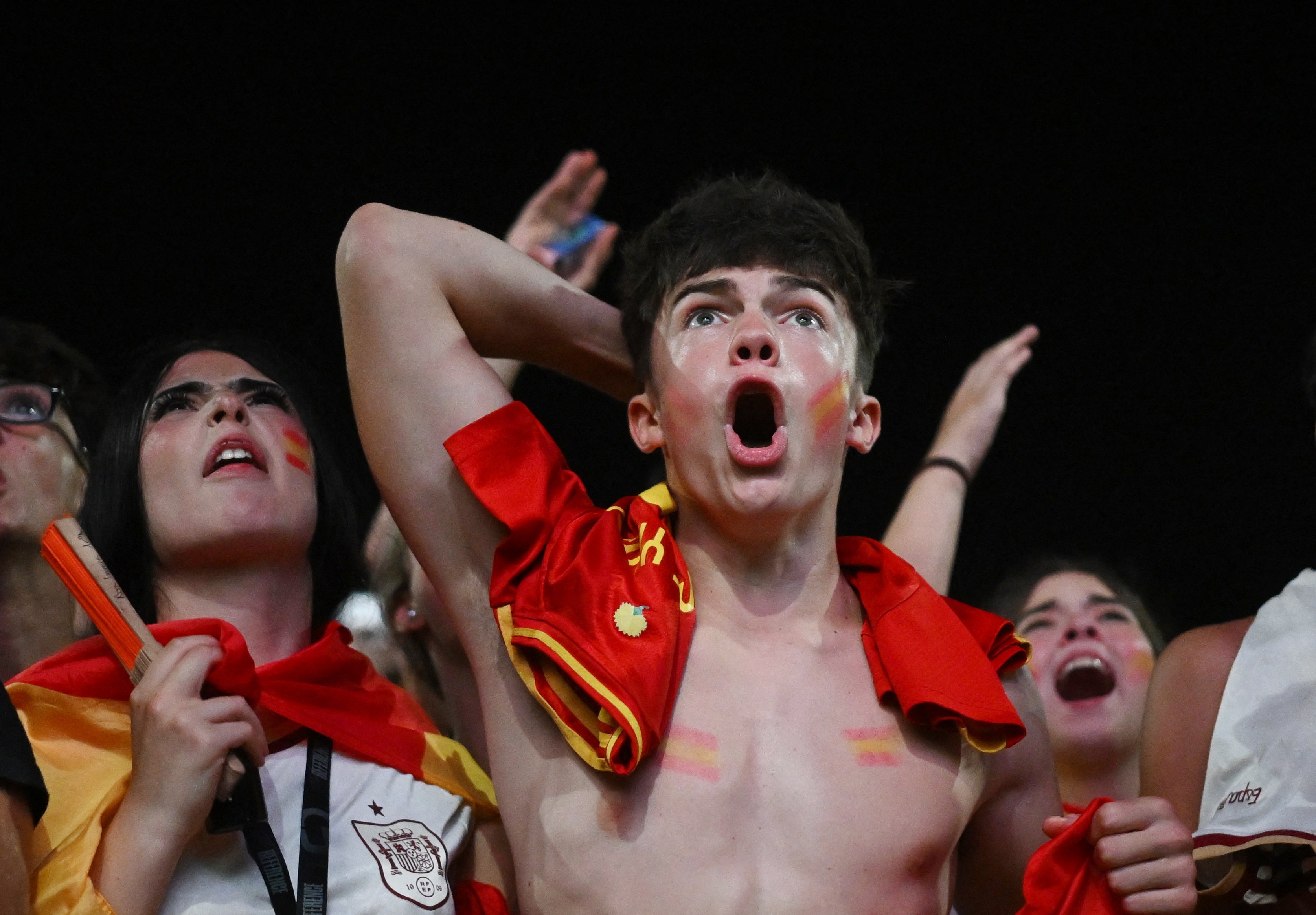 Spain fans react as they watch the FIFA World Cup final in- Rocafonda.