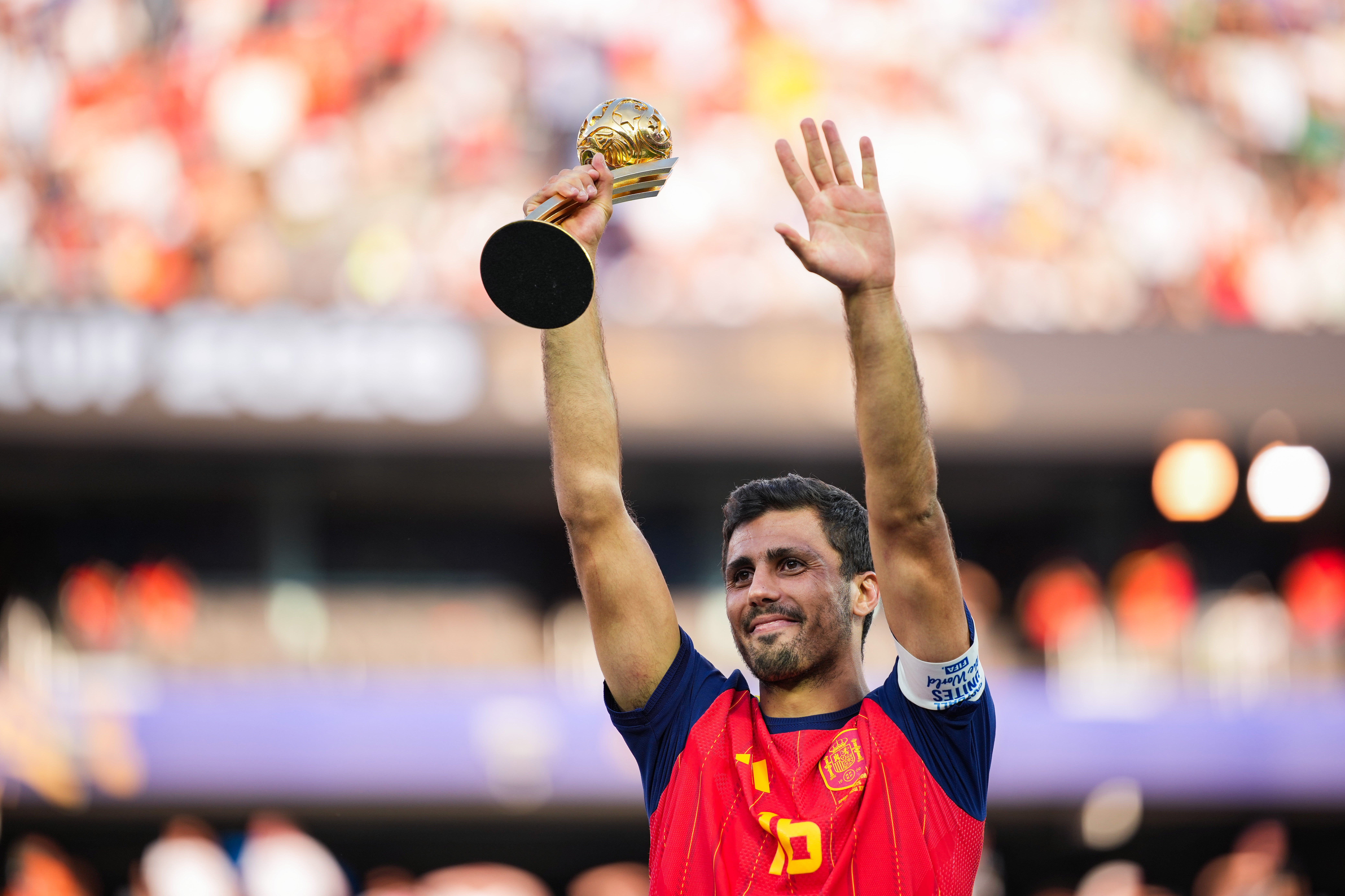 Rodri of Spain lifts up the Golden Ball award