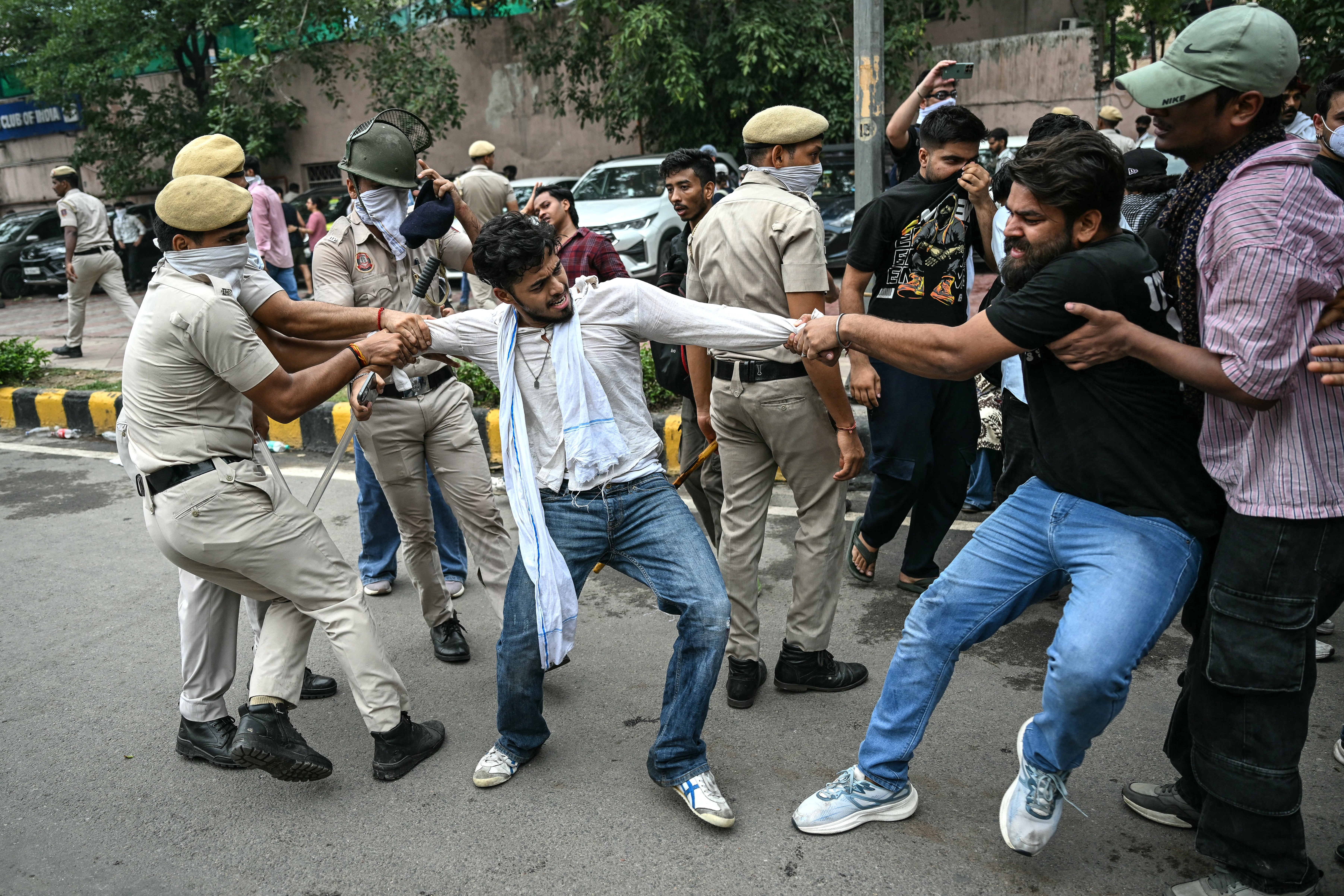 Activists and supporters of the Cockroach Janta Party clash with police during a protest in Delhi (AFP/Getty)
