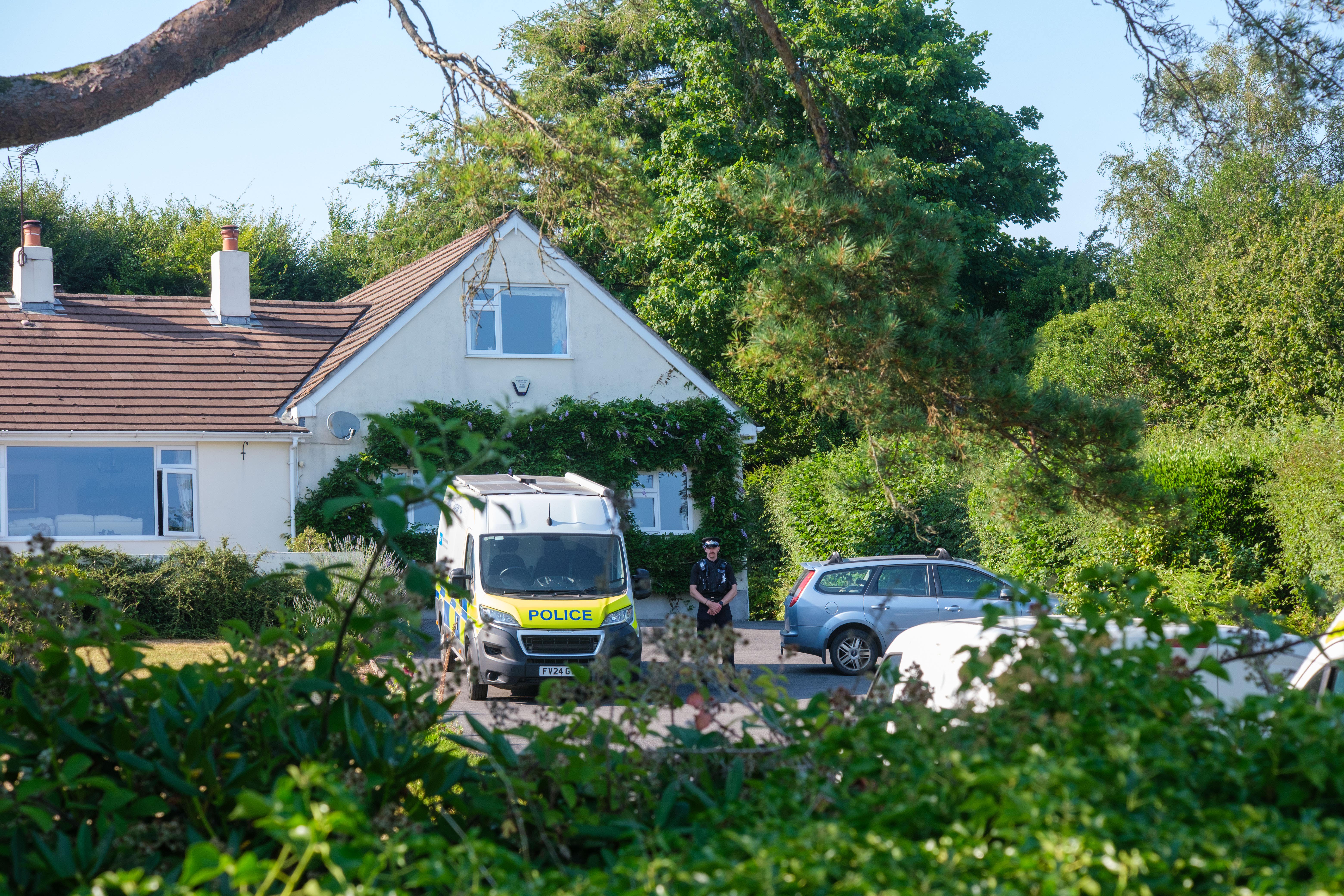 Police outside the house of Ann Widdecombe in Haytor, Dartmoor (PA Wire)