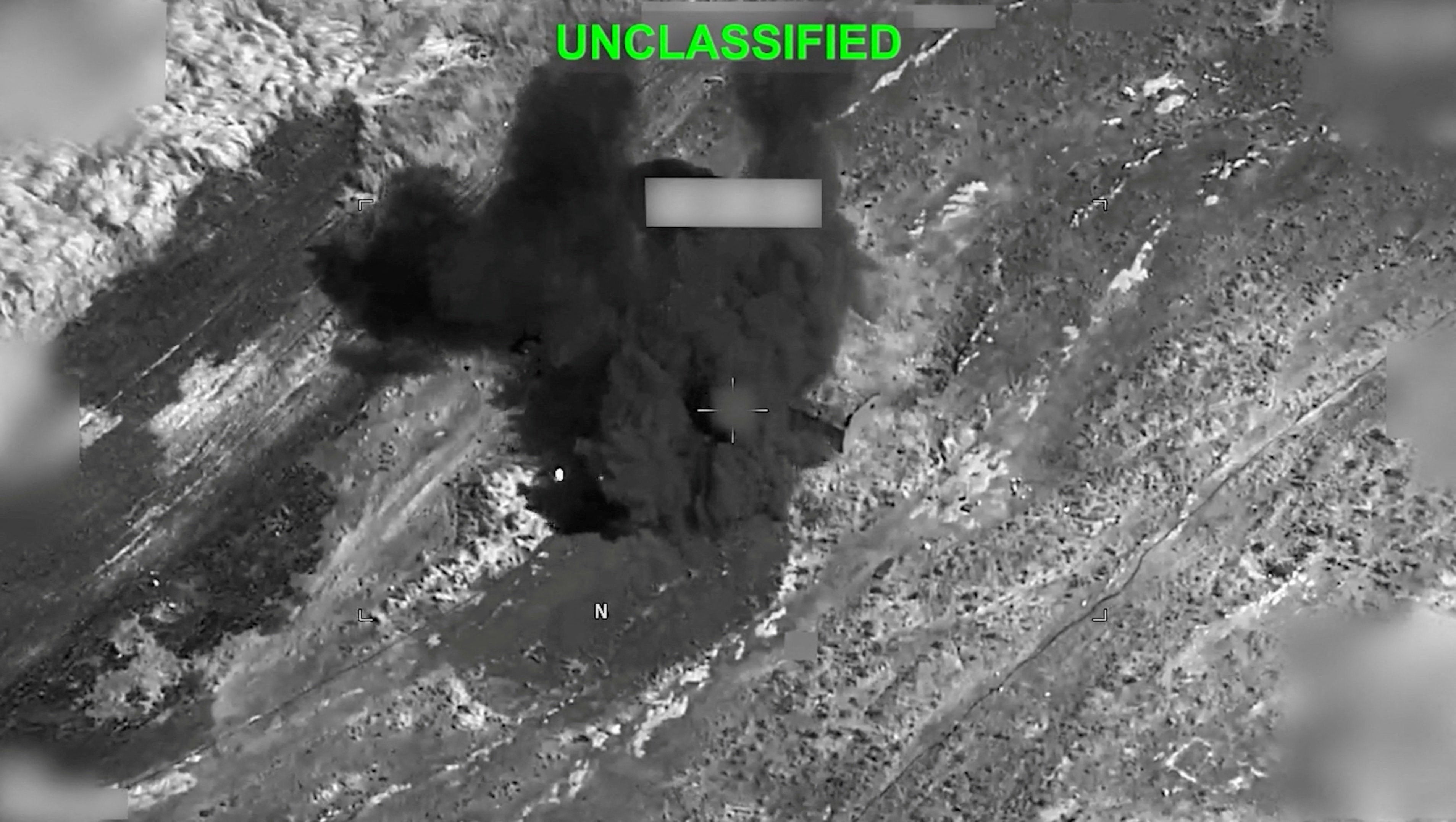 Smoke rises from an explosion at an unknown location, during what U.S. Central Command (CENTCOM) says are strikes on Iran, in this still image taken from a handout video released on July 19, 2026.