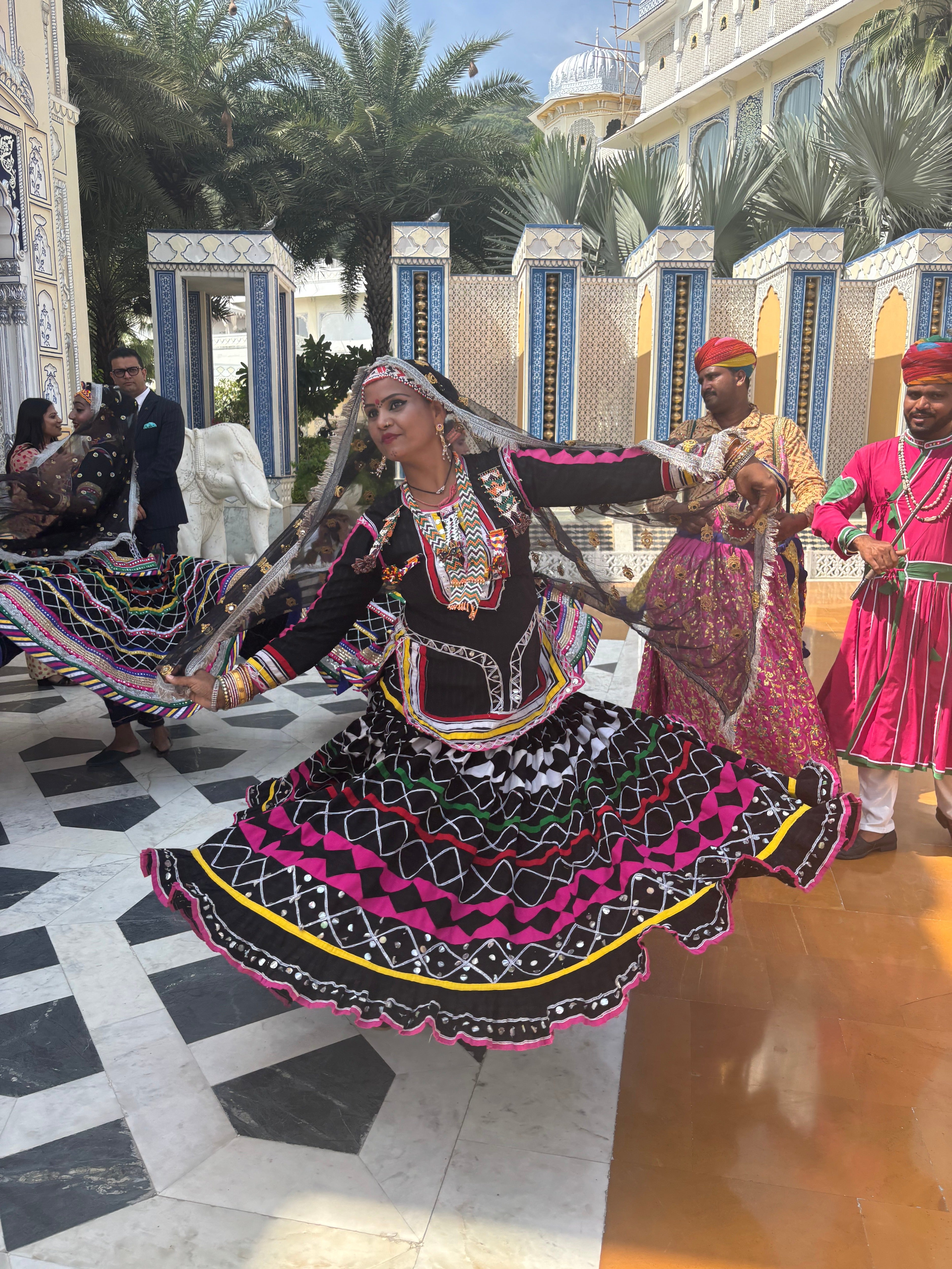 Traditional Kalbelia dancers and musicians greet guests on arrival at The Leela Palace Jaipur