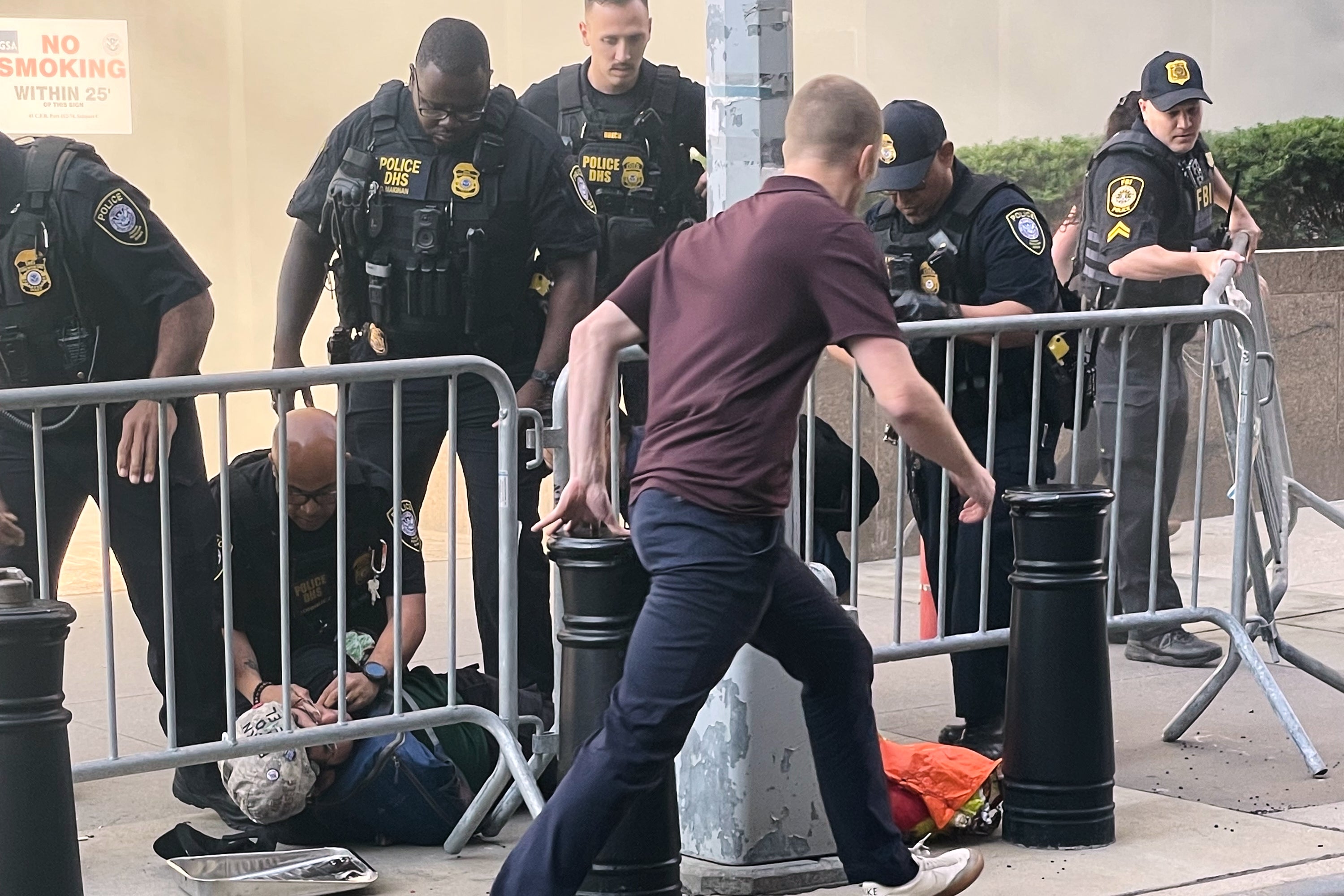 Law enforcement officers tackled a suspect and arrested him moments after his alleged attack on a New York City building that houses an ICE field office