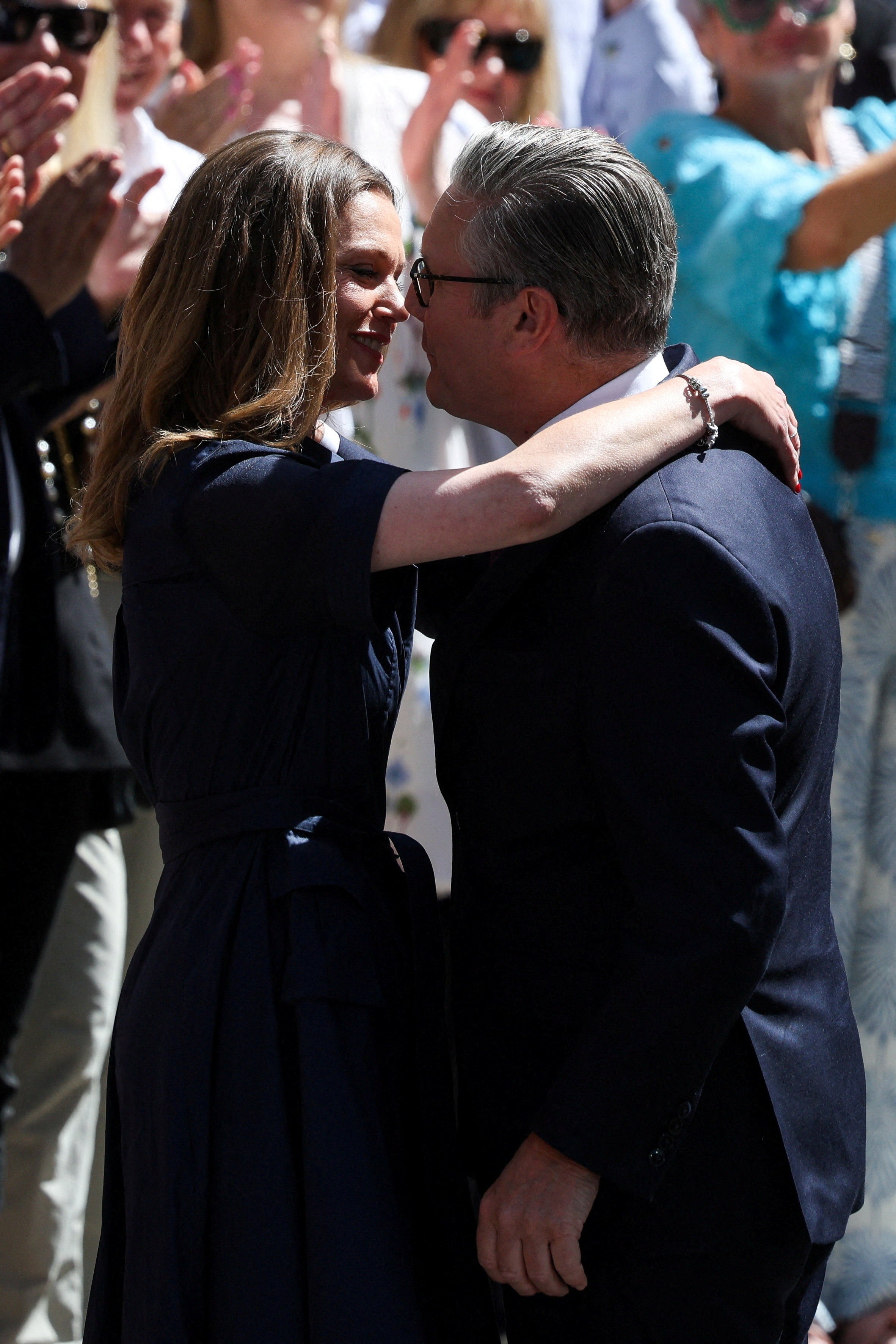 Victoria Starmer wore a navy wrap dress for her husband’s resignation (Reuters)
