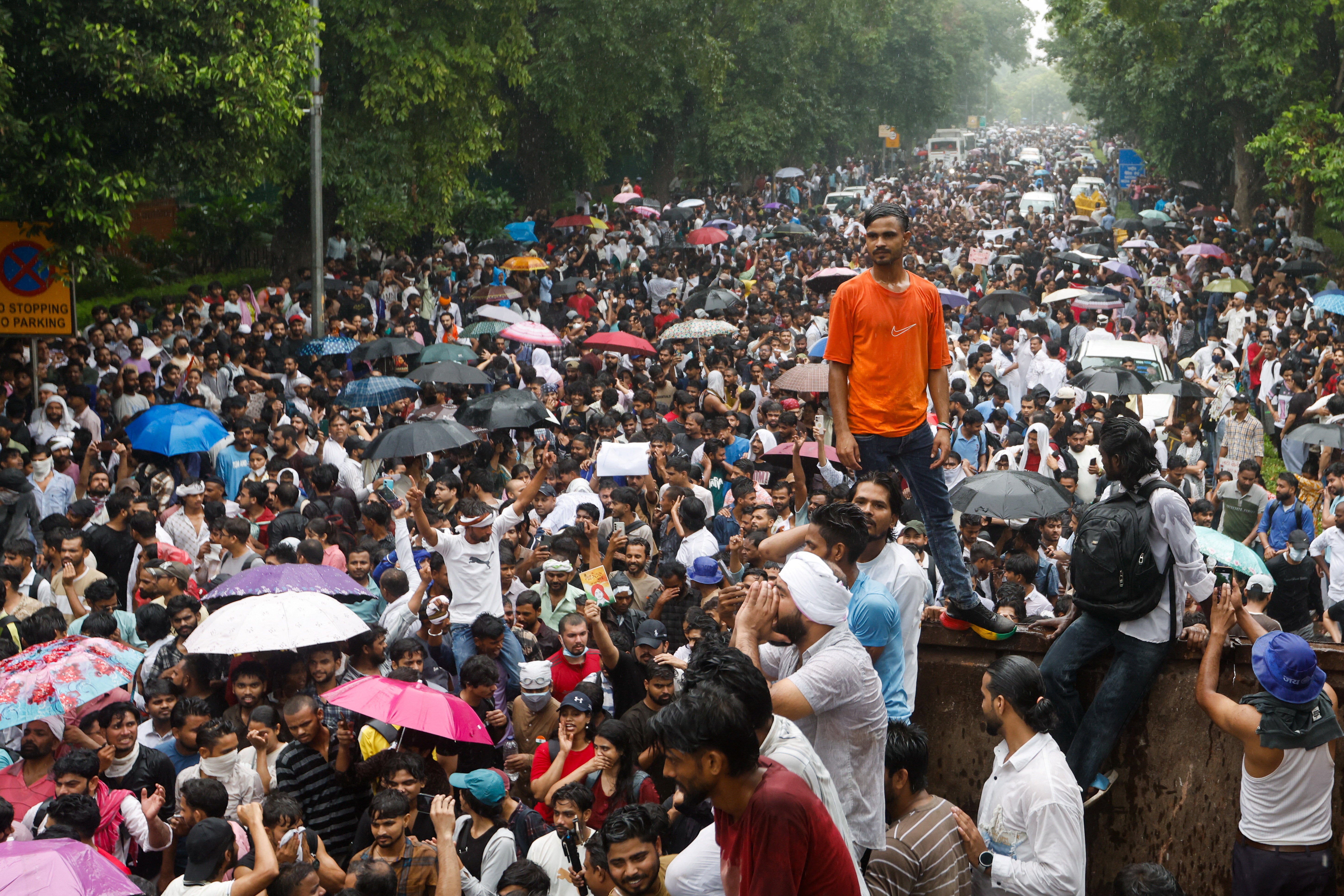 Supporters of the Cockroach Janta Party gather as they march toward parliament