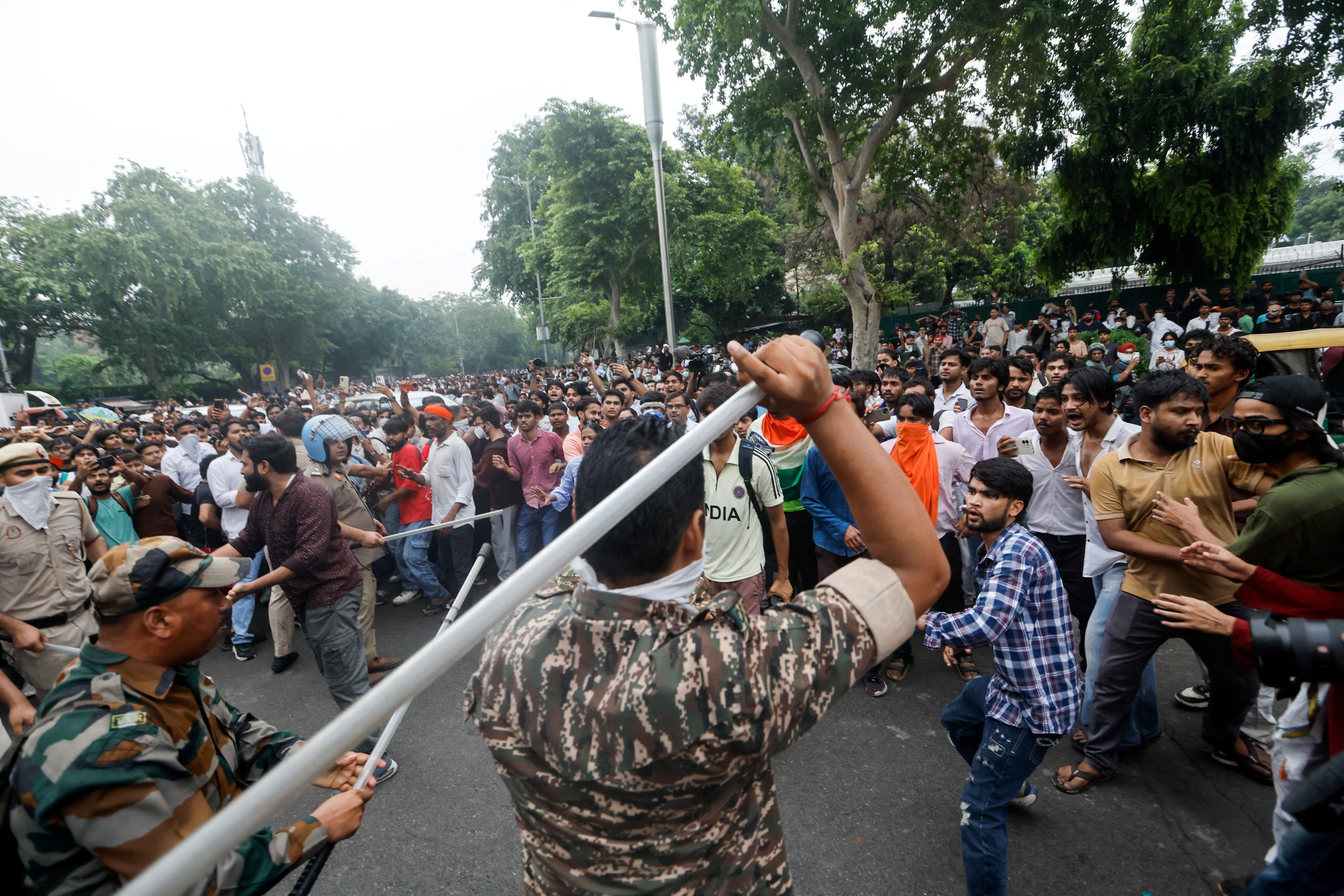 Police use batons to disperse the crowd