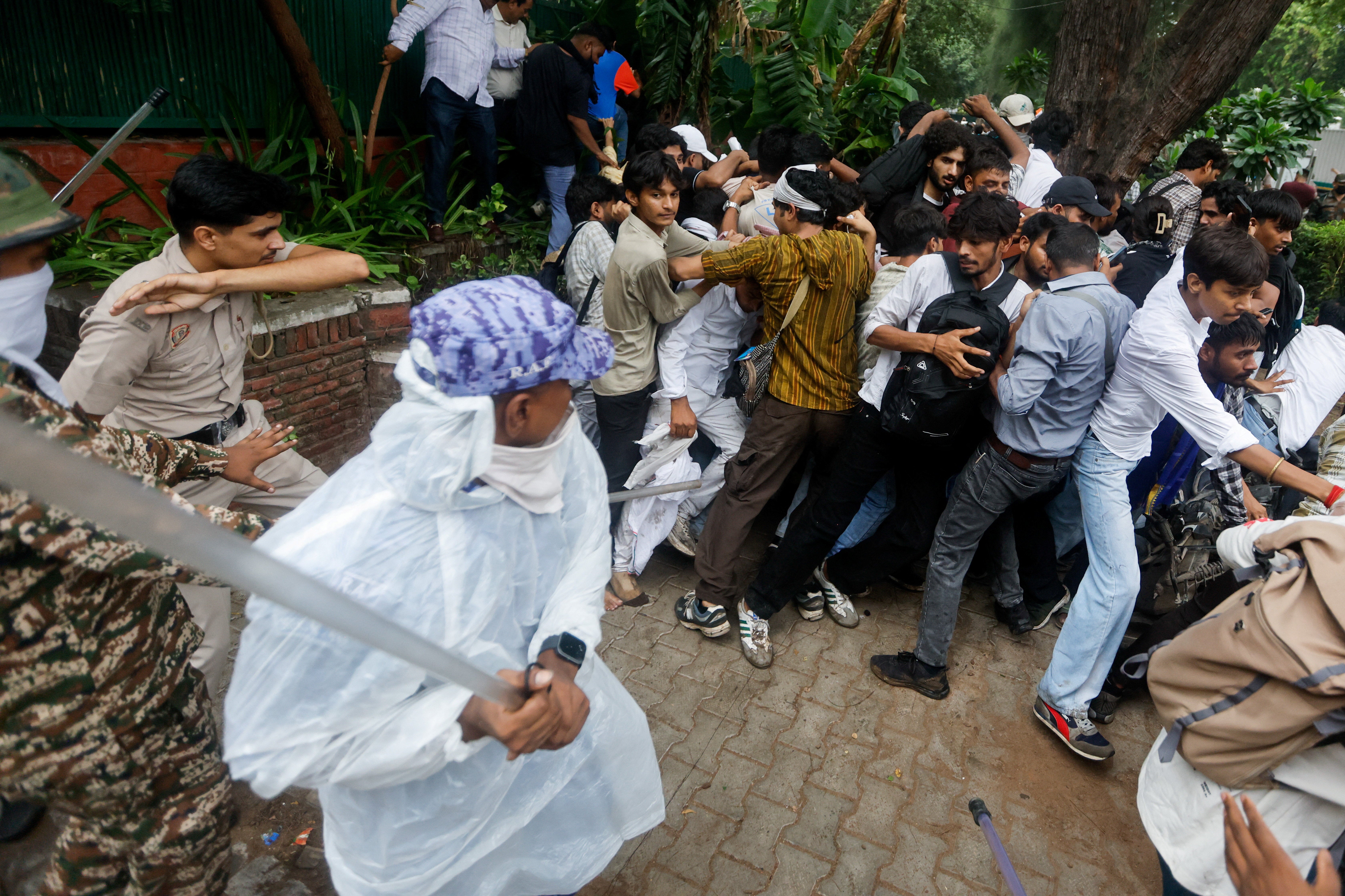 Police use batons to disperse supporters of the Cockroach Janta Party