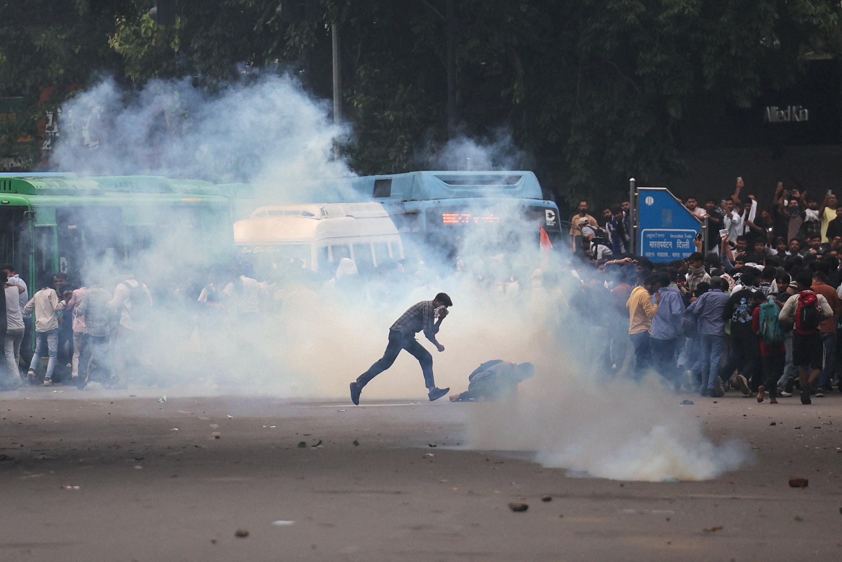 Tear gas spreads around protesters