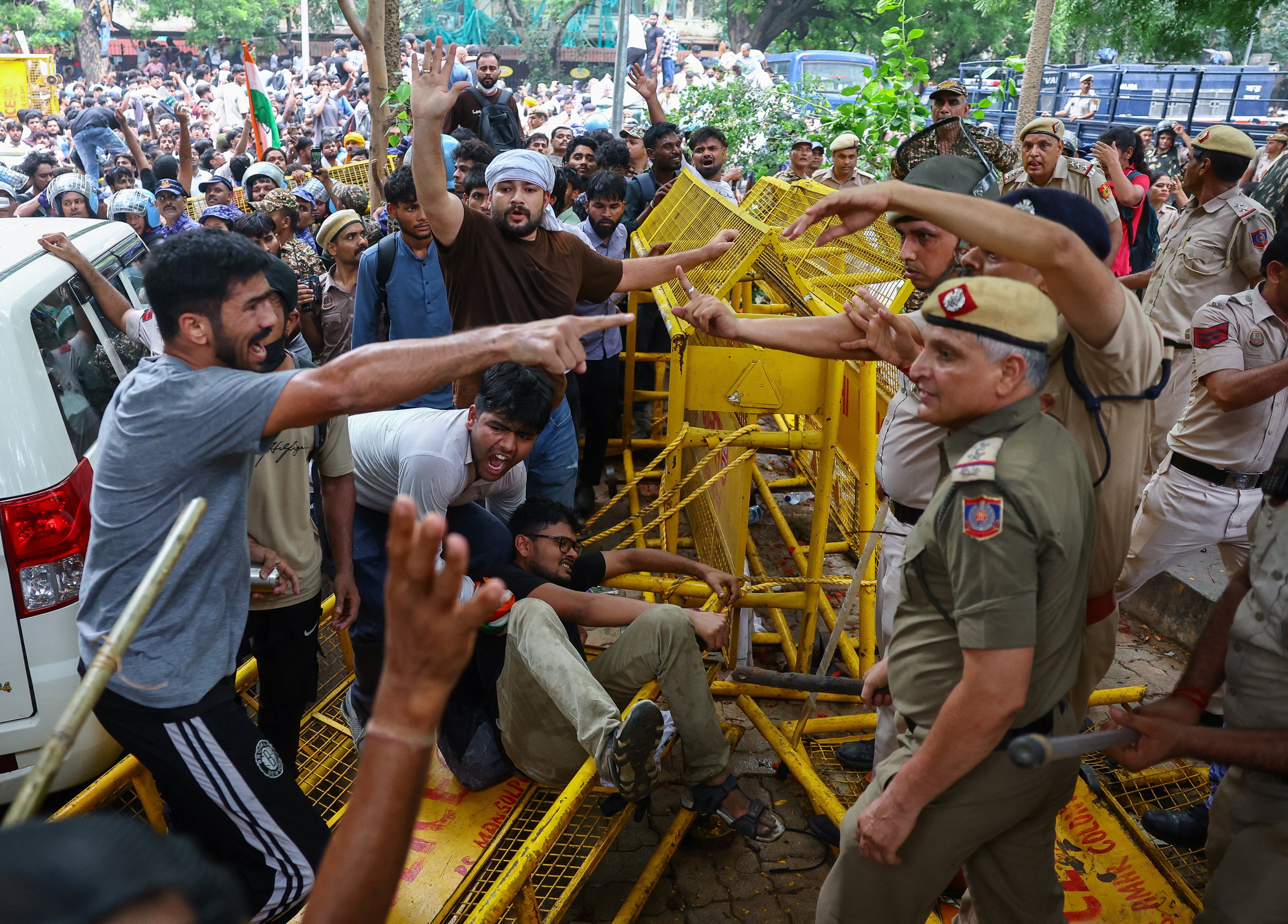 Protesters scuffle with police officers