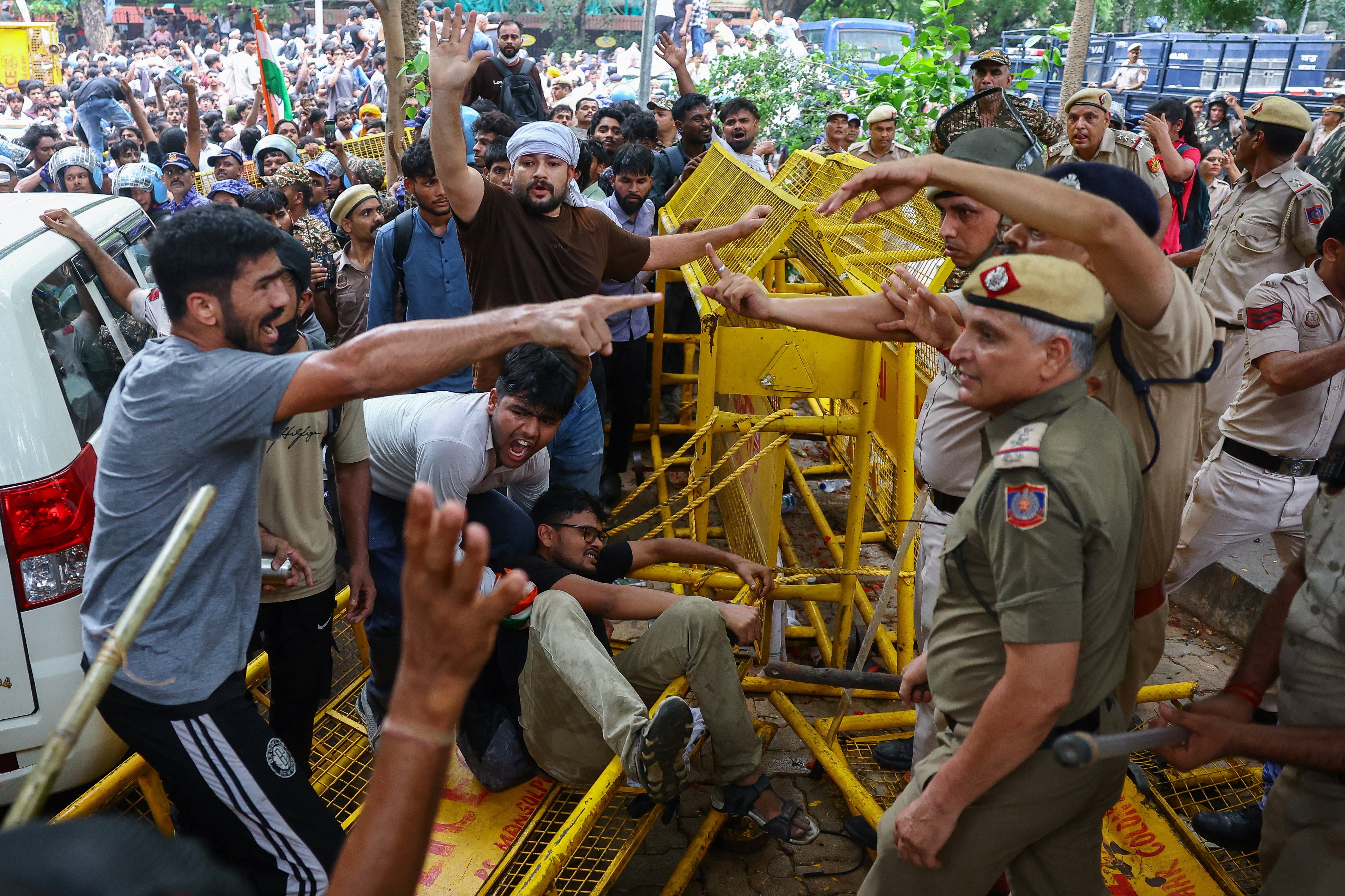 Protesters scuffle with police officers (Reuters)