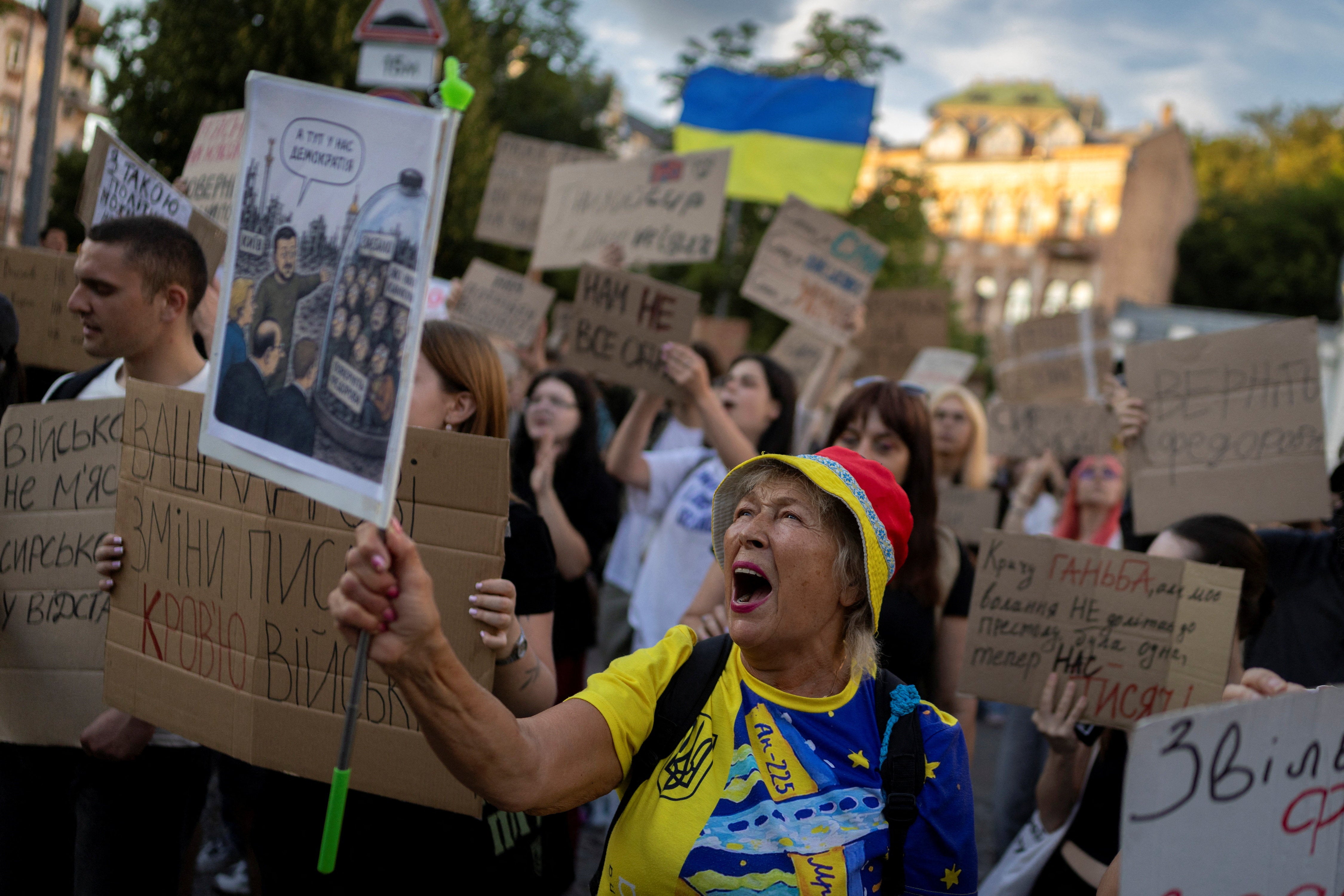 People shout slogans during a protest demanding the reinstatement of Mykhailo Fedorov as defence minister and calling for the resignation of Commander in Chief of the Ukrainian Armed Forces Oleksandr Syrskyi in Kyiv (Reuters)