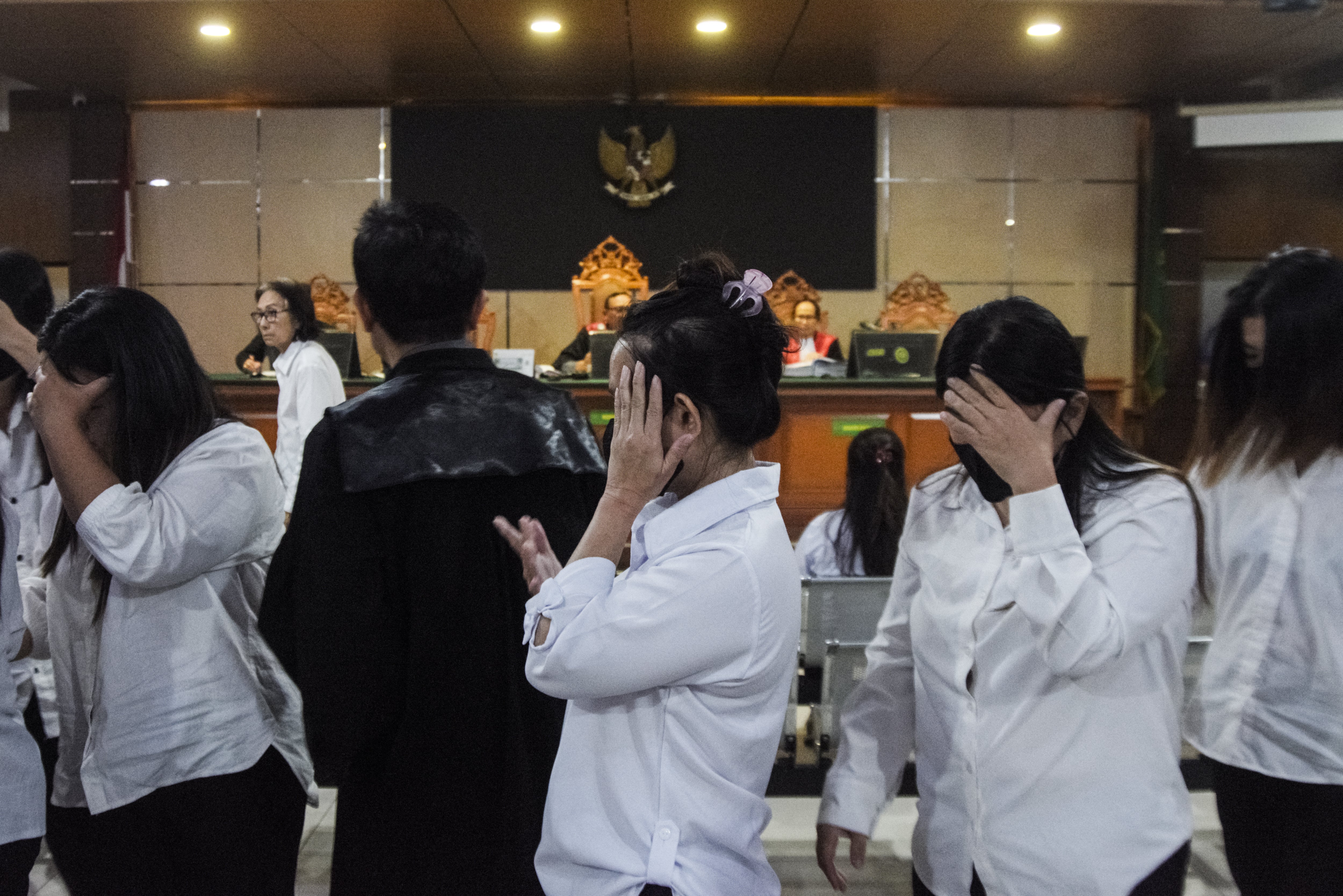 File. Defendants leave after a trial in a baby trafficking case at the Bandung District Court in Bandung, West Java, on 14 April 2026 (AFP/Getty)