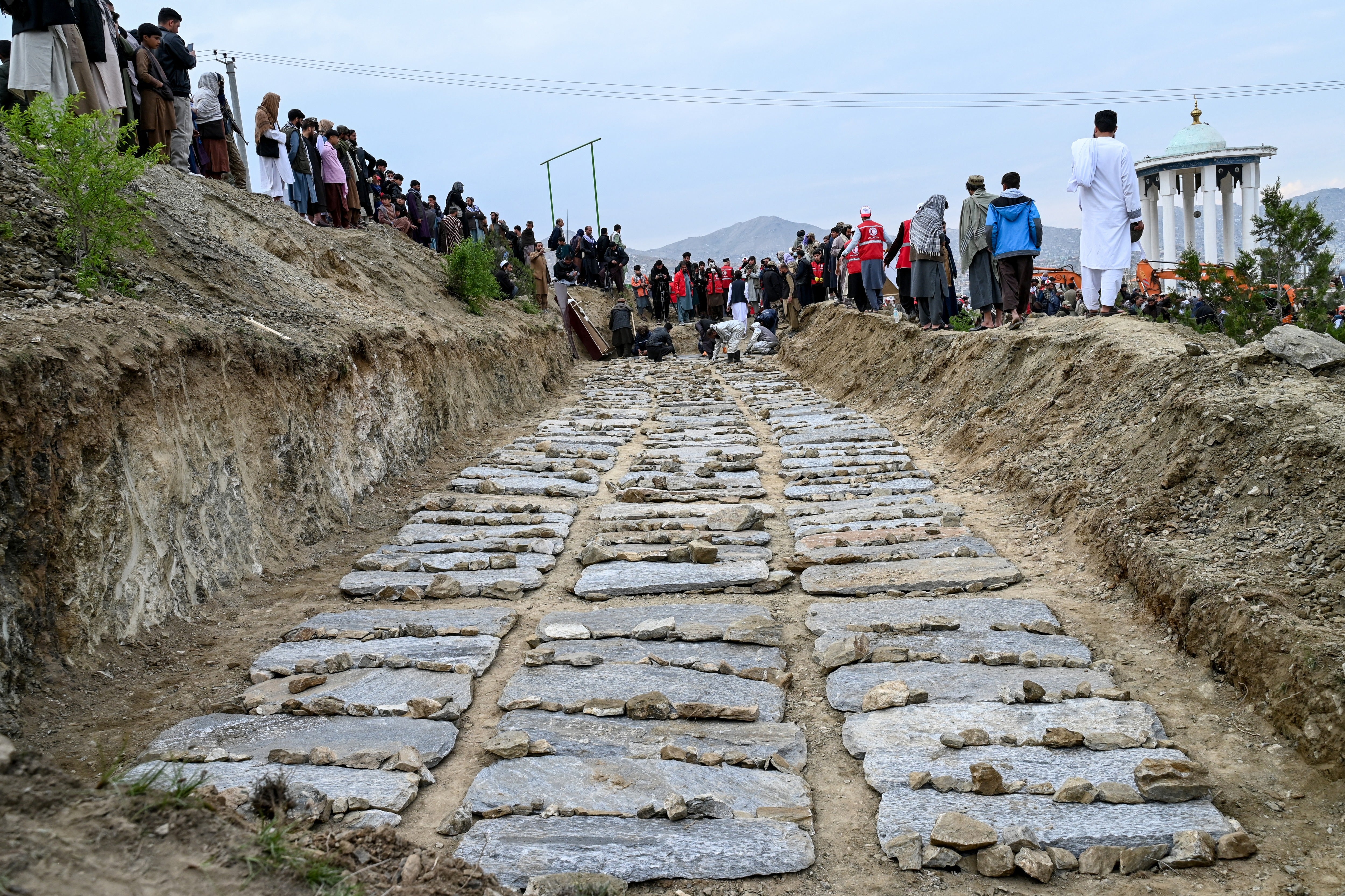 A mass grave for victims of an alleged Pakistani airstrike on a drug rehabilitation centre in Kabul