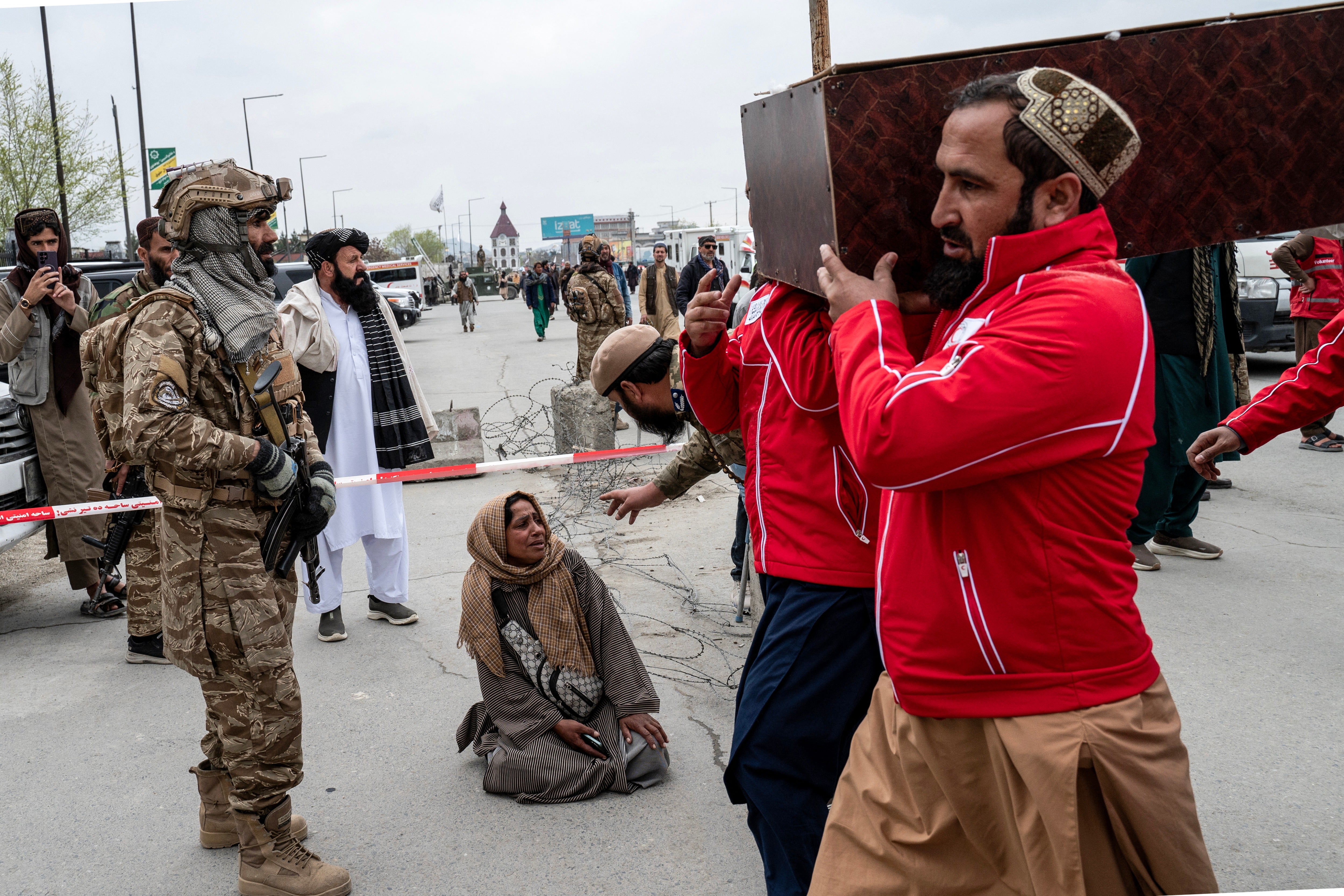 Afghan volunteers carry the coffin of a victim of the alleged Pakistani airstrike on a drug rehabilitation centre in Kabul