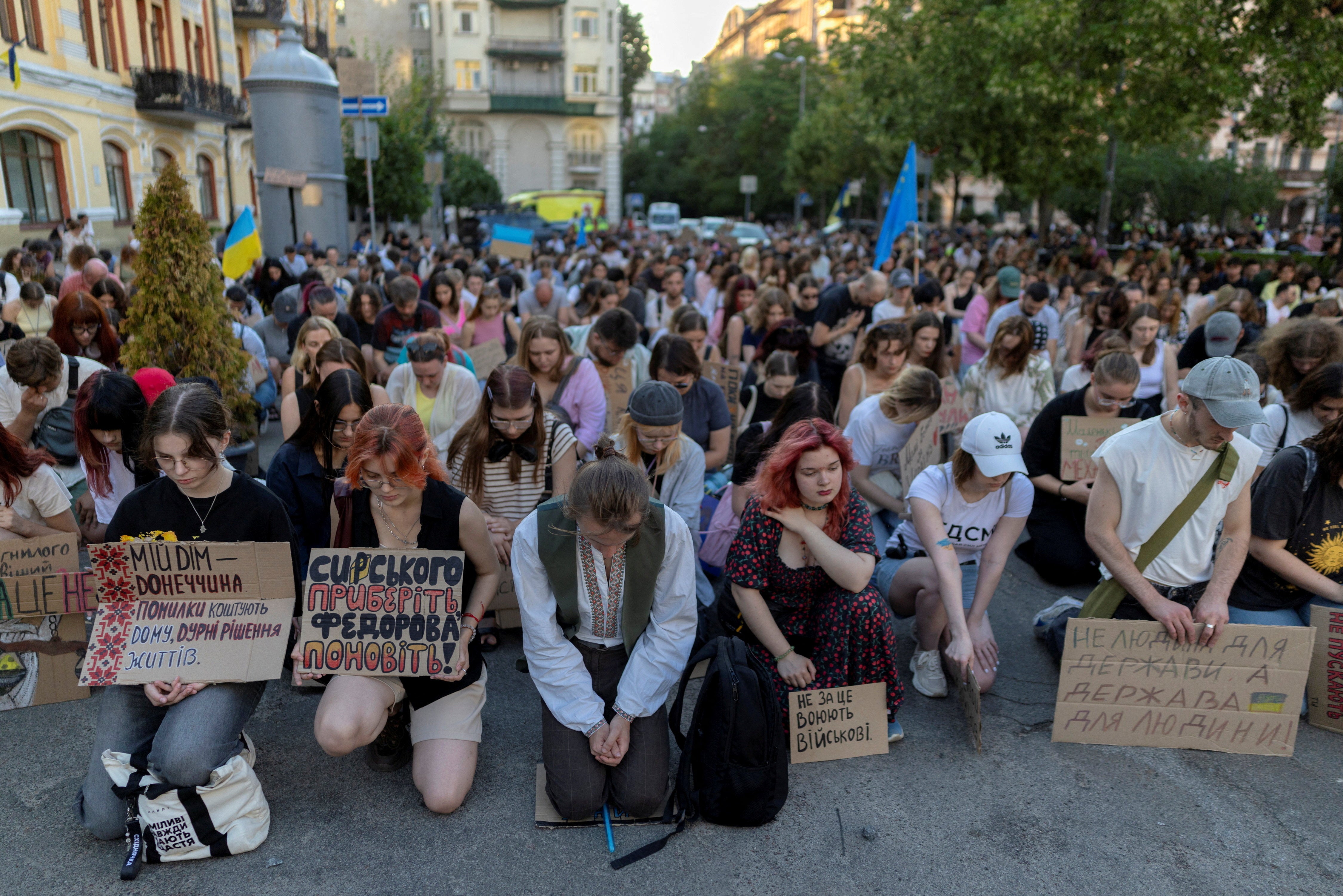 People observe a minute of silence during a protest demanding the reinstatement of Mykhailo Fedorov as defence minister and calling for the resignation of Commander in Chief of the Ukrainian Armed Forces Oleksandr Syrskyi
