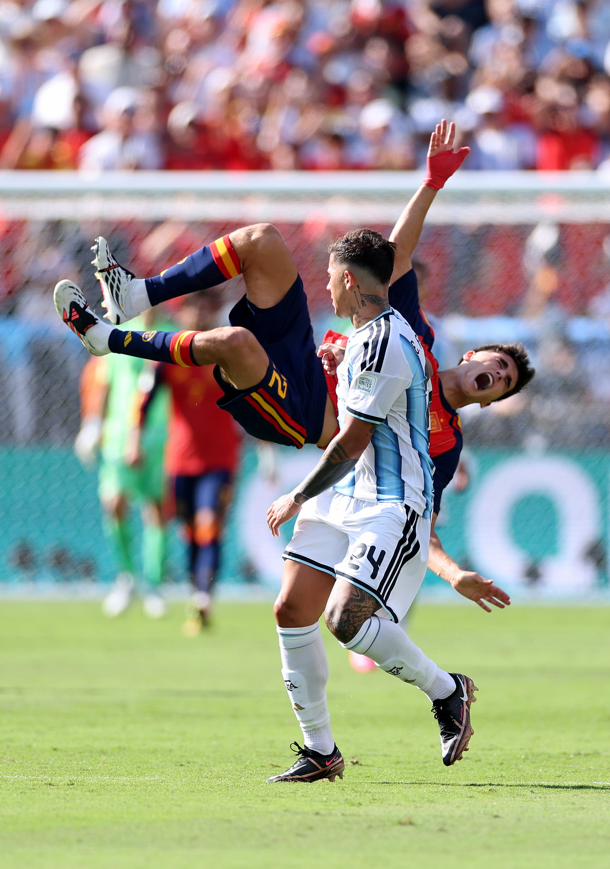 Enzo Fernandez #24 of Argentina fouls Pau Cubarsi #22 of Spain during the final