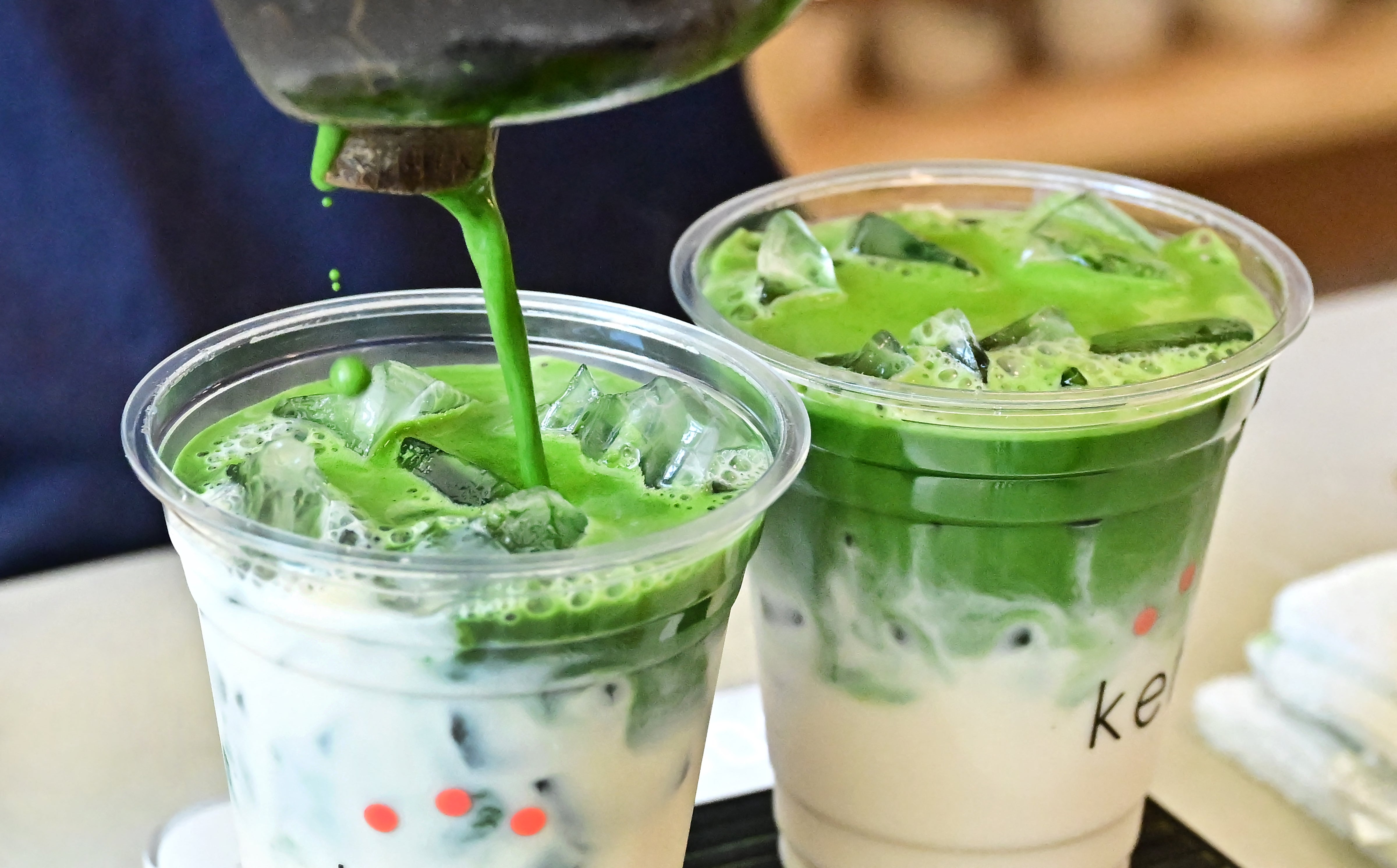 Green flag: would you slip into a big interview with a matcha latte? (AFP/Getty)