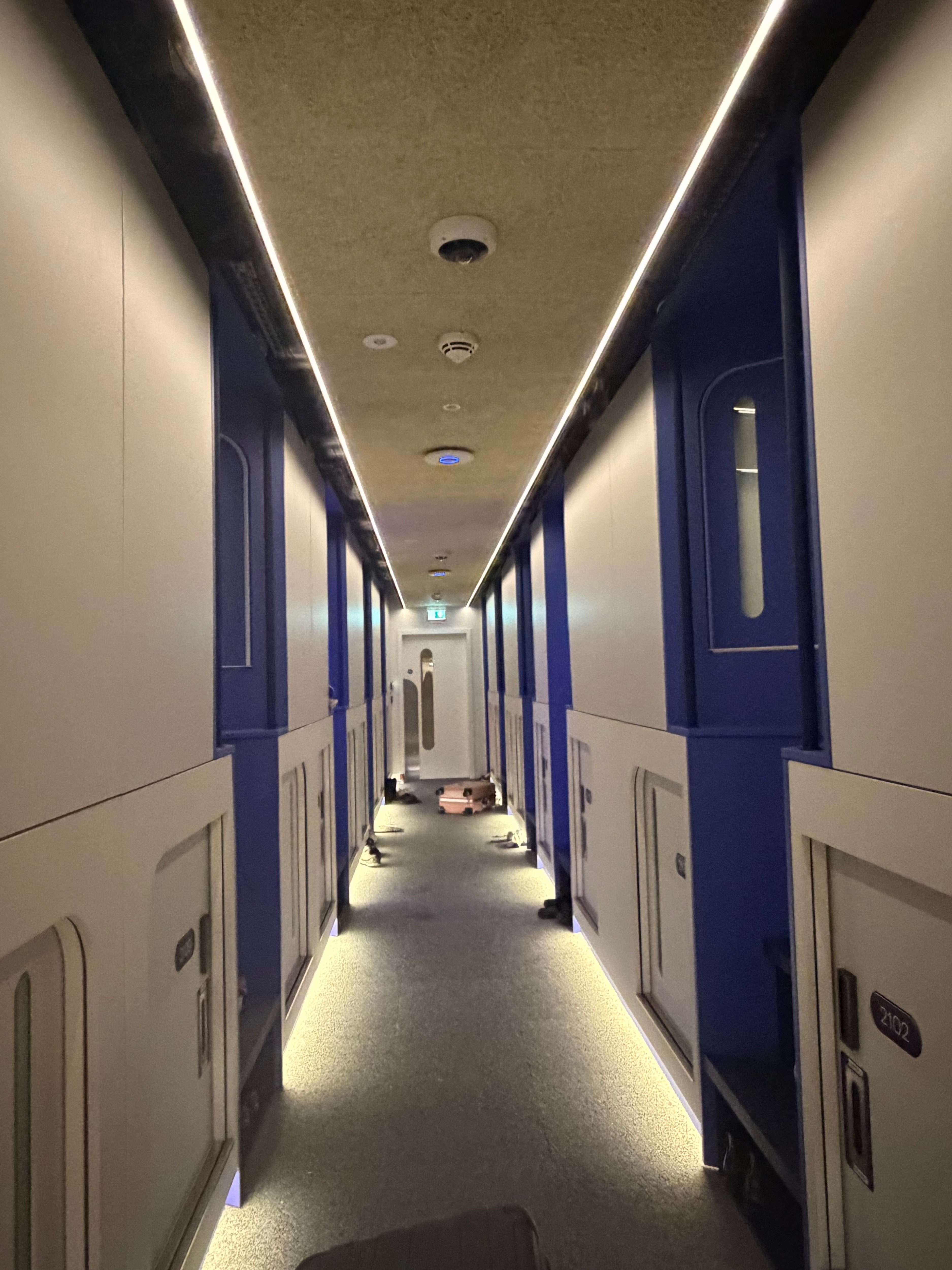 The corridor of tiny capsule doors at Otherwander