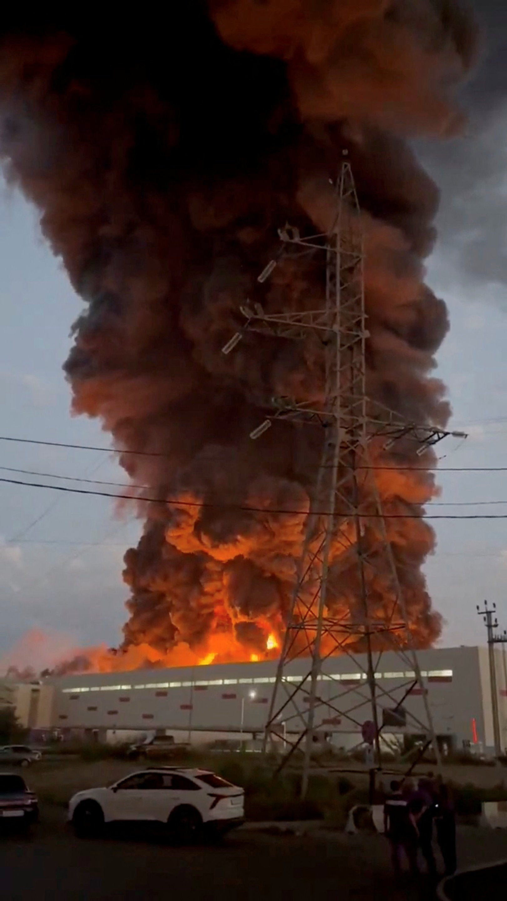 Smoke rises from a Wildberries warehouse on fire after an attack in Nevinnomyssk, Russia, July 22 (Reuters)