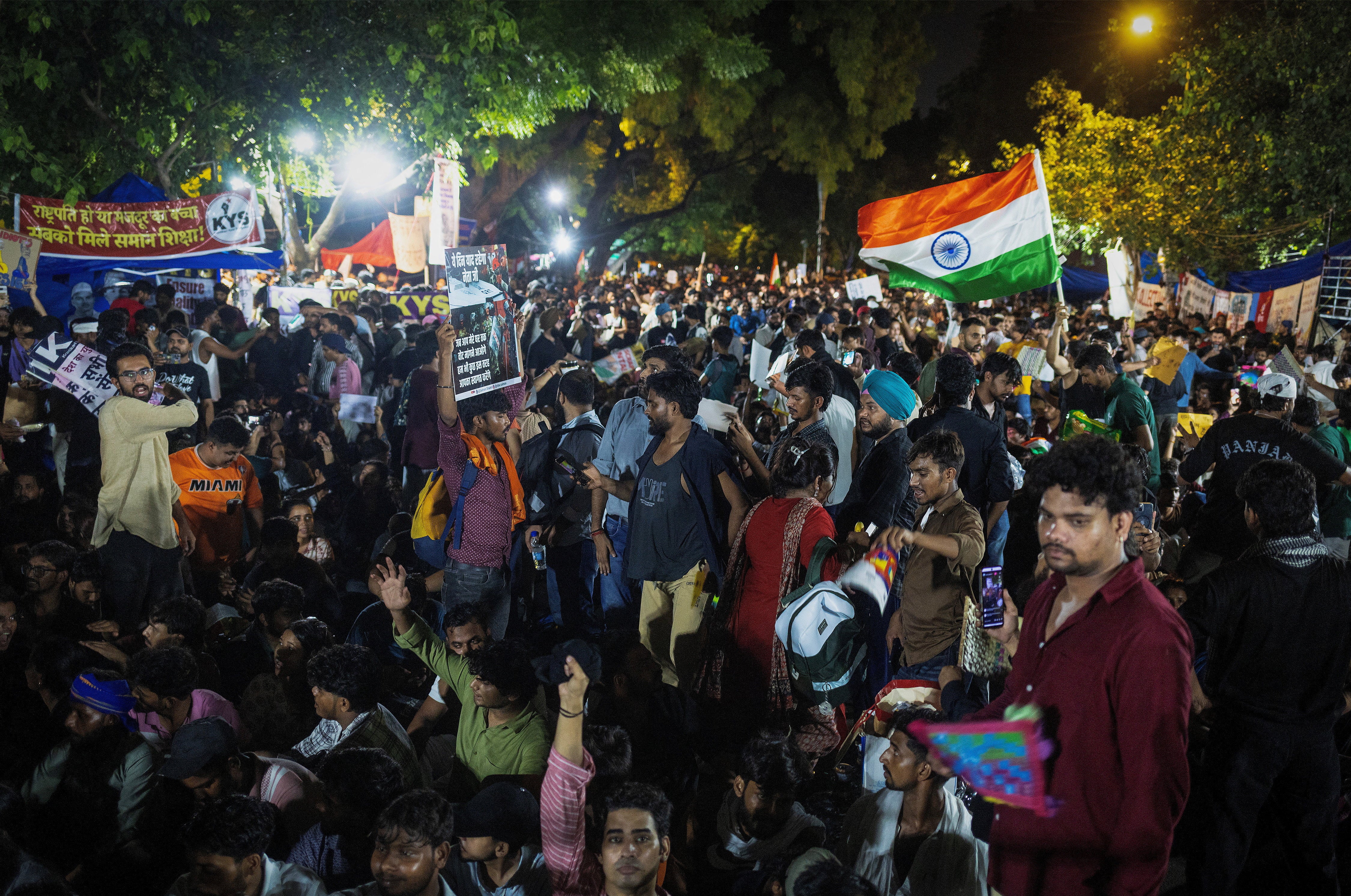 Supporters of India's Cockroach Janta Party (CJP) shout slogans at a protest site (Reuters)