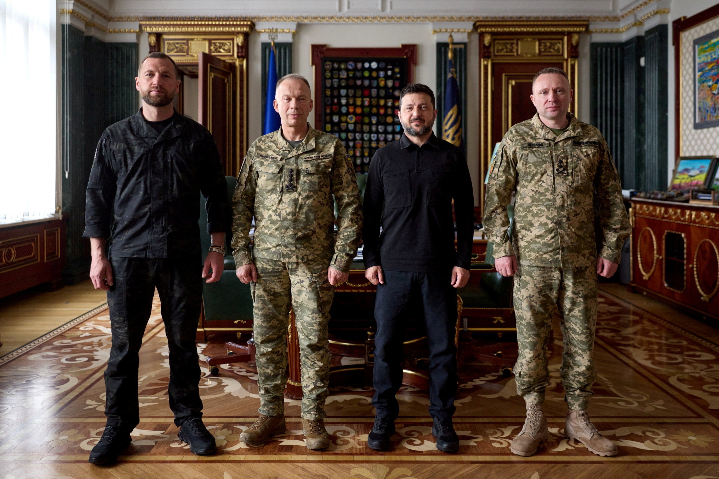 Volodymyr Zelensky, newly appointed Commander-in-Chief of the Ukrainian Armed Forces Major General Mykhailo Drapatyi, his predecessor General Oleksandr Syrskyi, and Acting Defence Minister Yevhenii Khmara