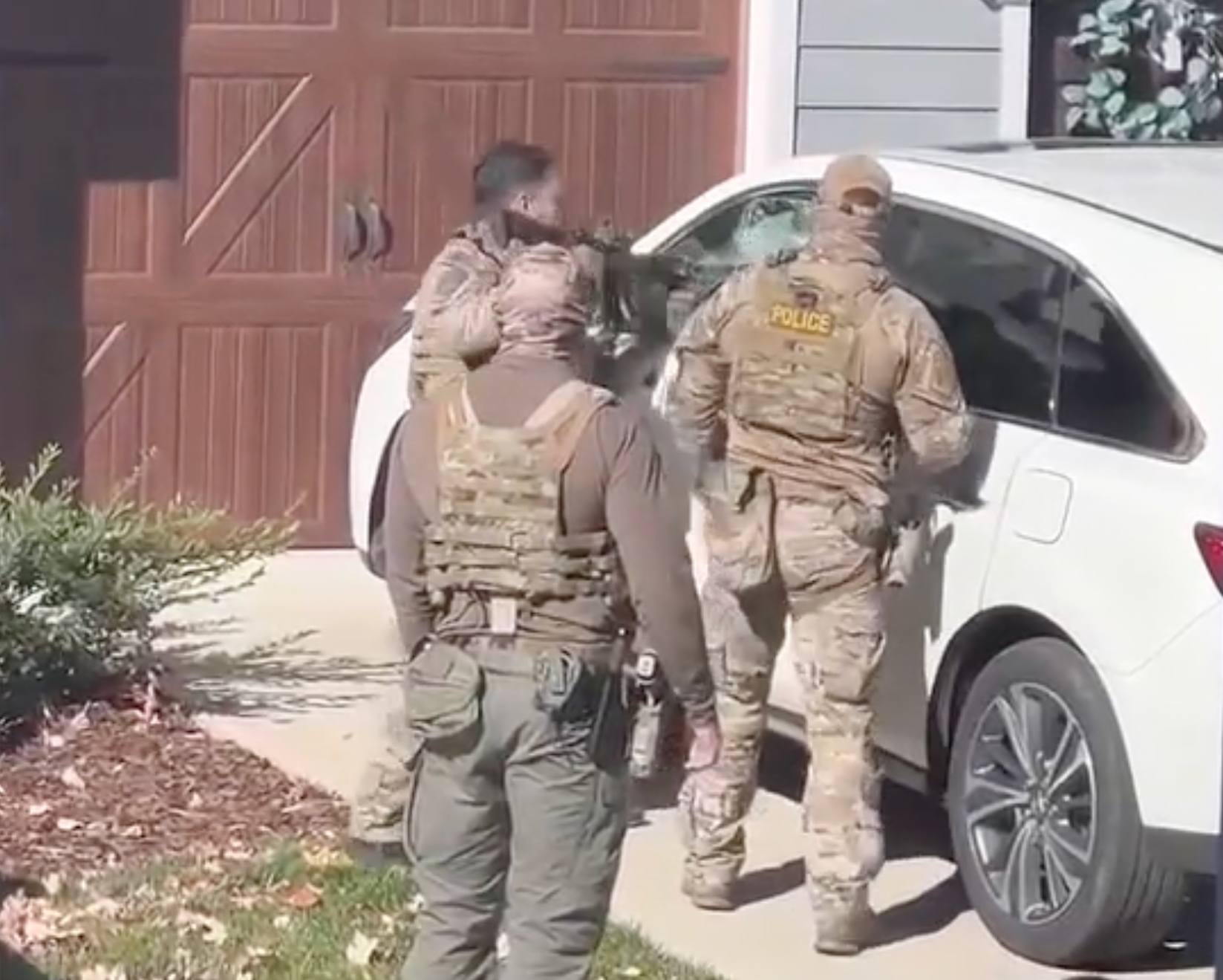 Customs and Border Protection agents smash Tatyana Reisini's car window in with an assault rifle in Charlotte, North Carolina, on November 17 last year