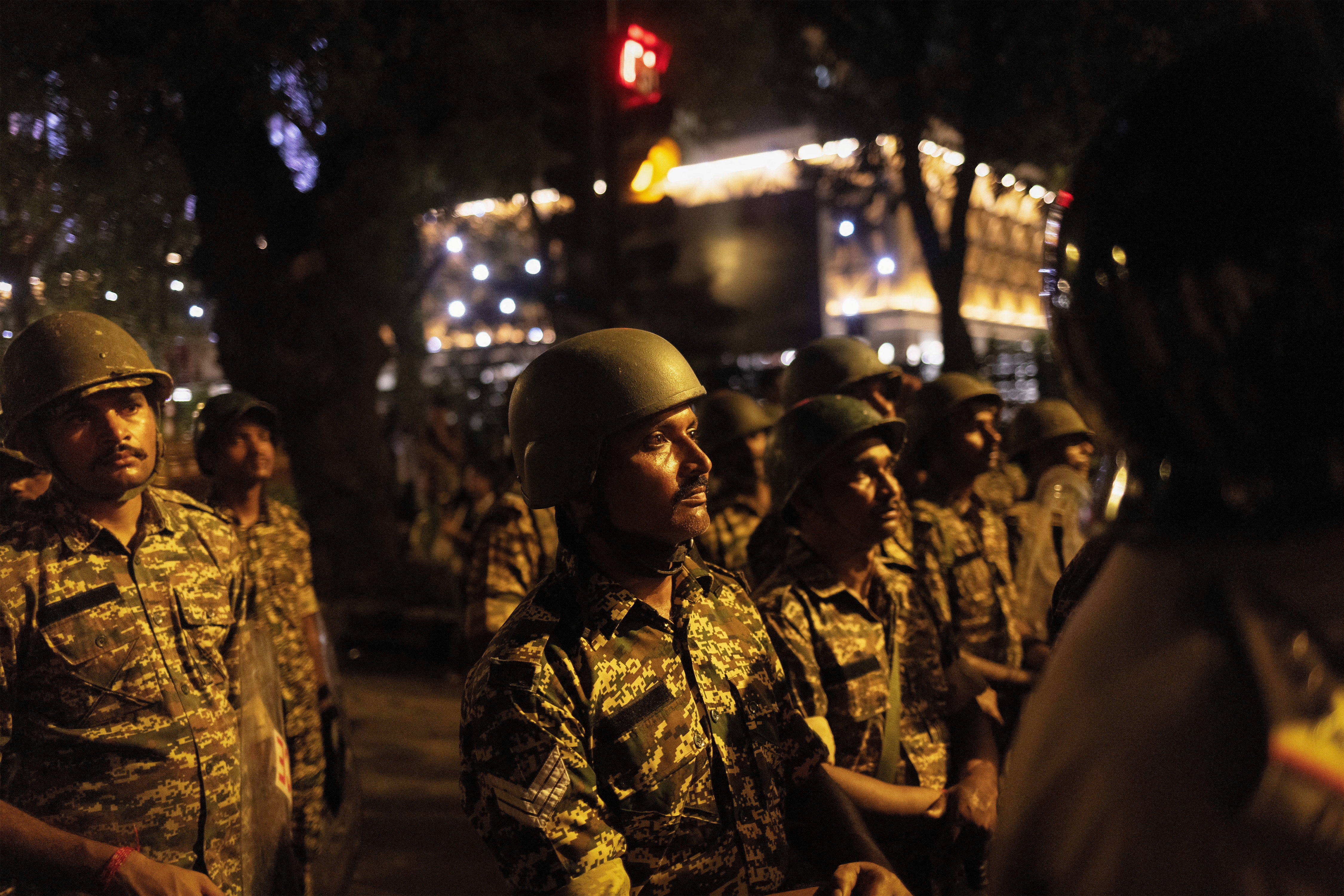 Policemen stand guard during the ongoing protest of Cockroach Janata Party (CJP), two days after thousands of protesters marched towards parliament demanding the resignation of education minister Dharmendra Pradhan (Reuters)