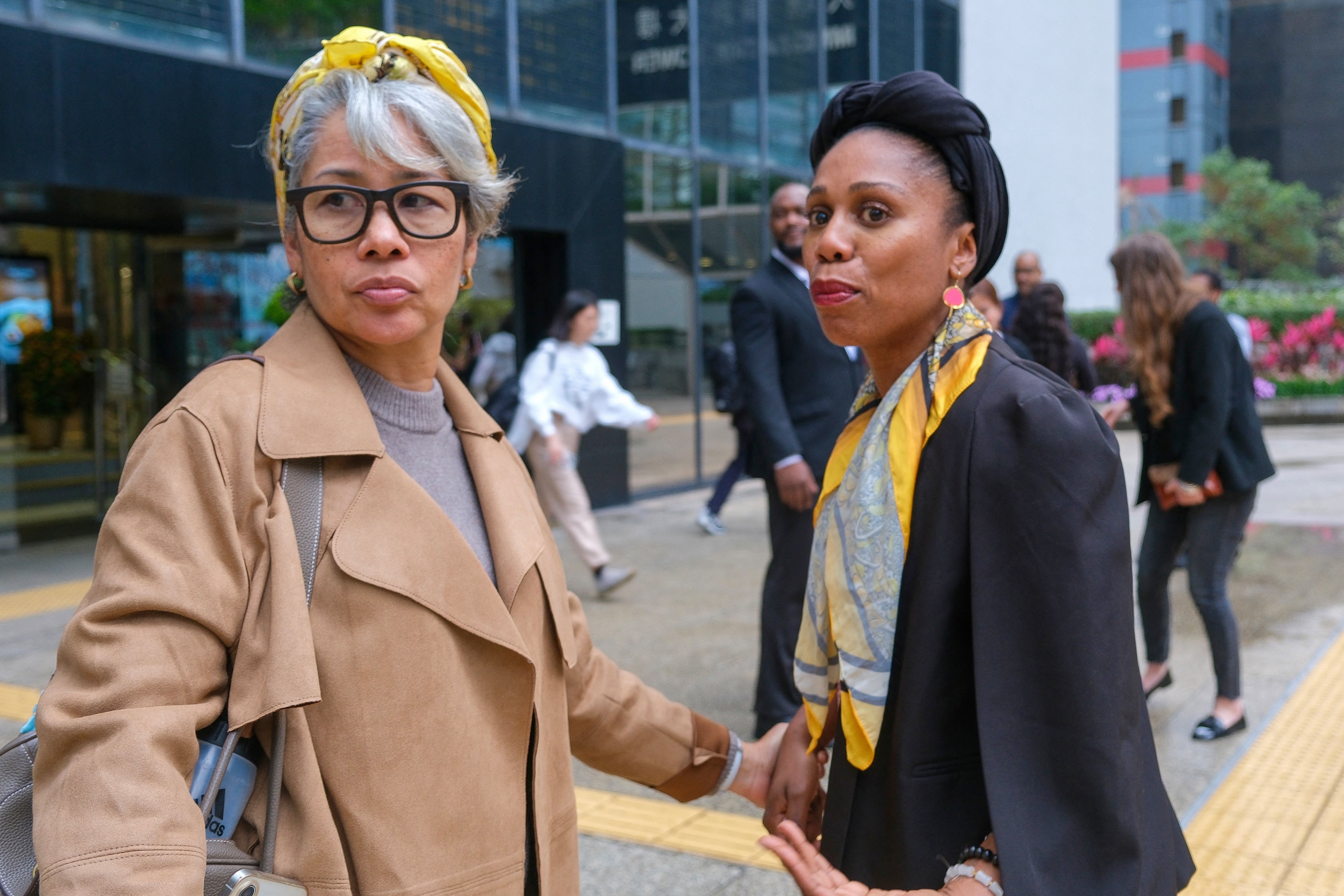 Aysha Bell, right, mother of Isabel Rose, reacts outside the Hong Kong District Court on 3 March 2026