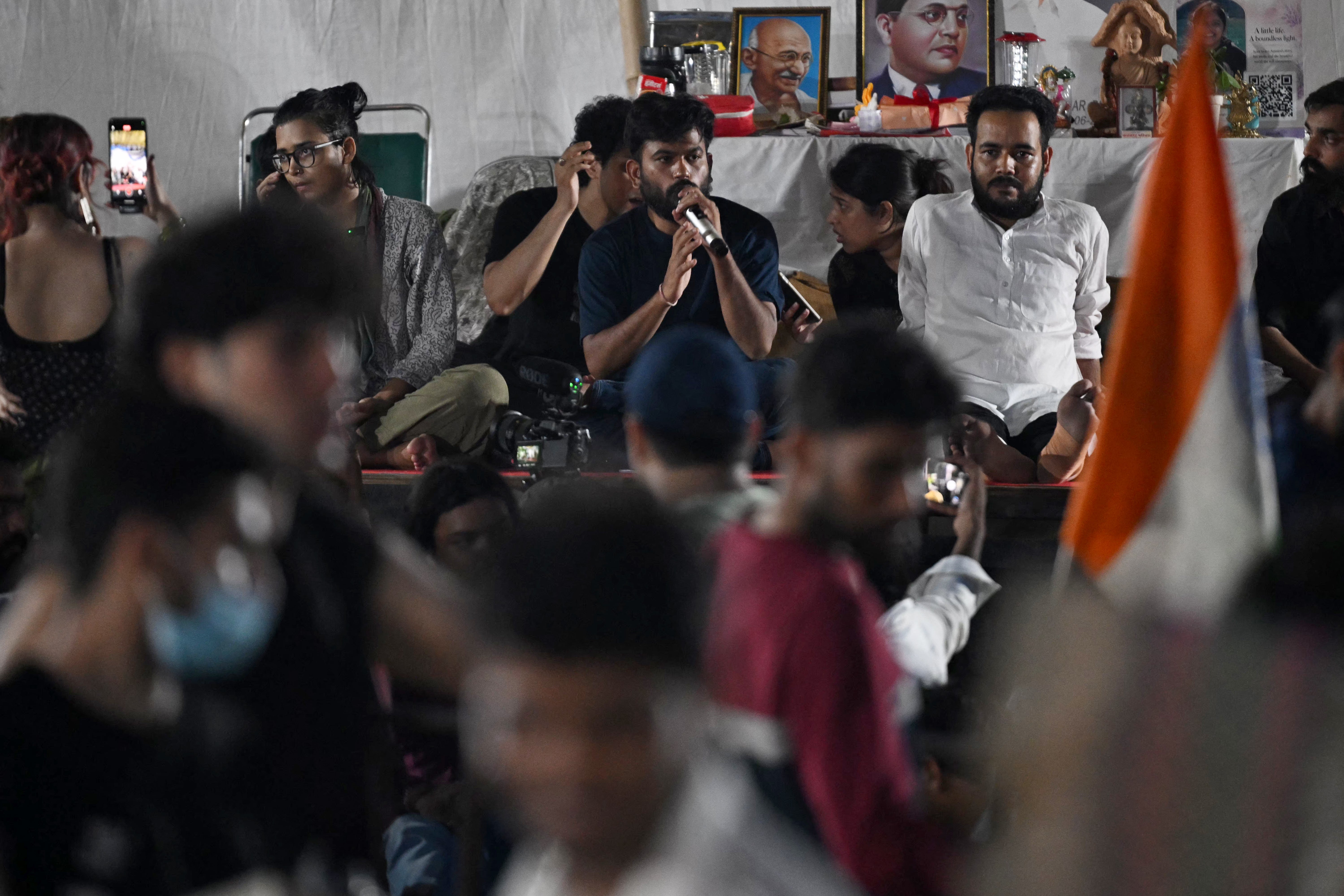 Cockroach Janta Party (CJP) founder Abhijeet Dipke (C) addresses supporters during their ongoing protest at the Jantar Mantar in New Delhi on 22 July 2026 (AFP/Getty)