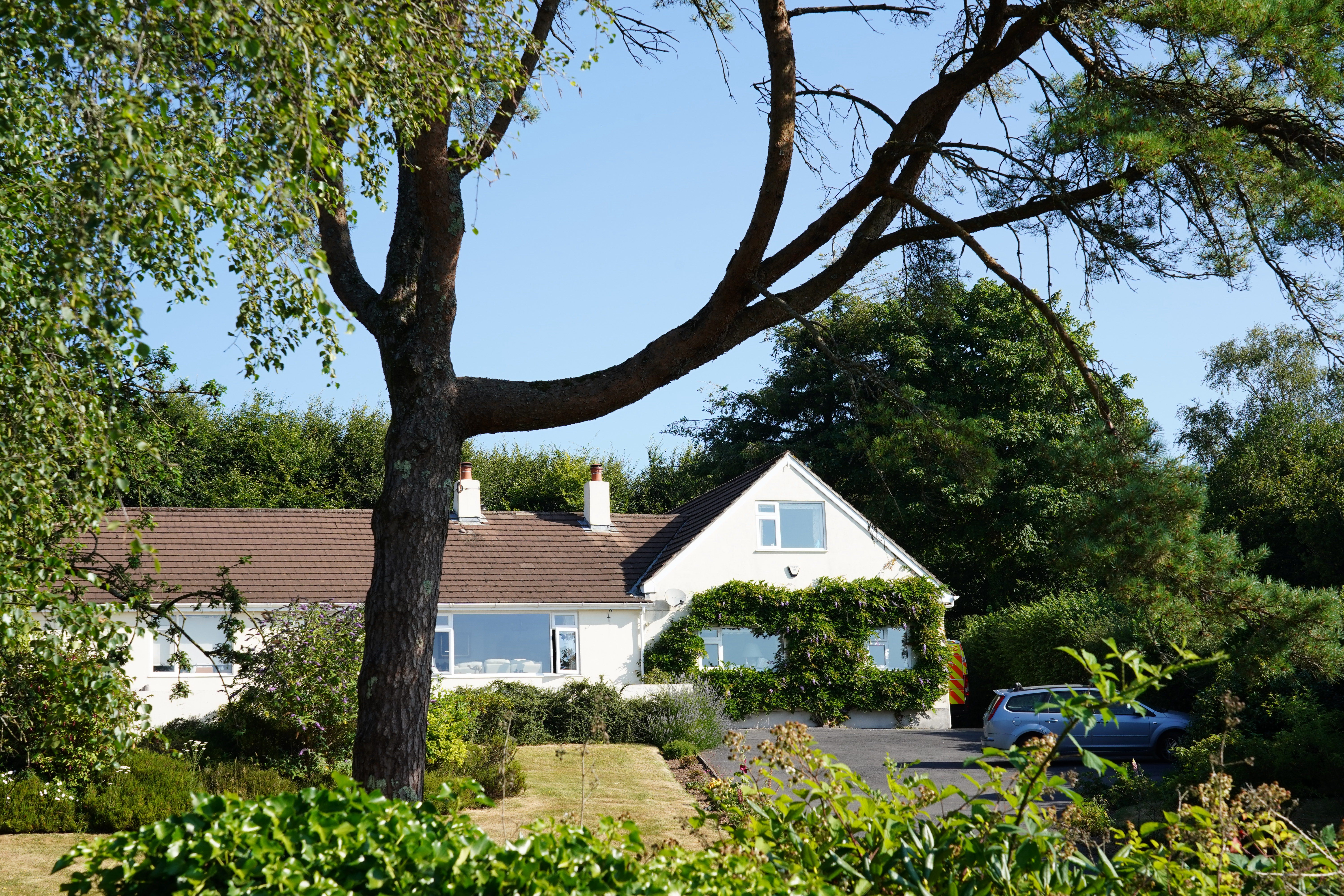 Police outside the house of Ann Widdecombe in Haytor in Dartmoor (PA)