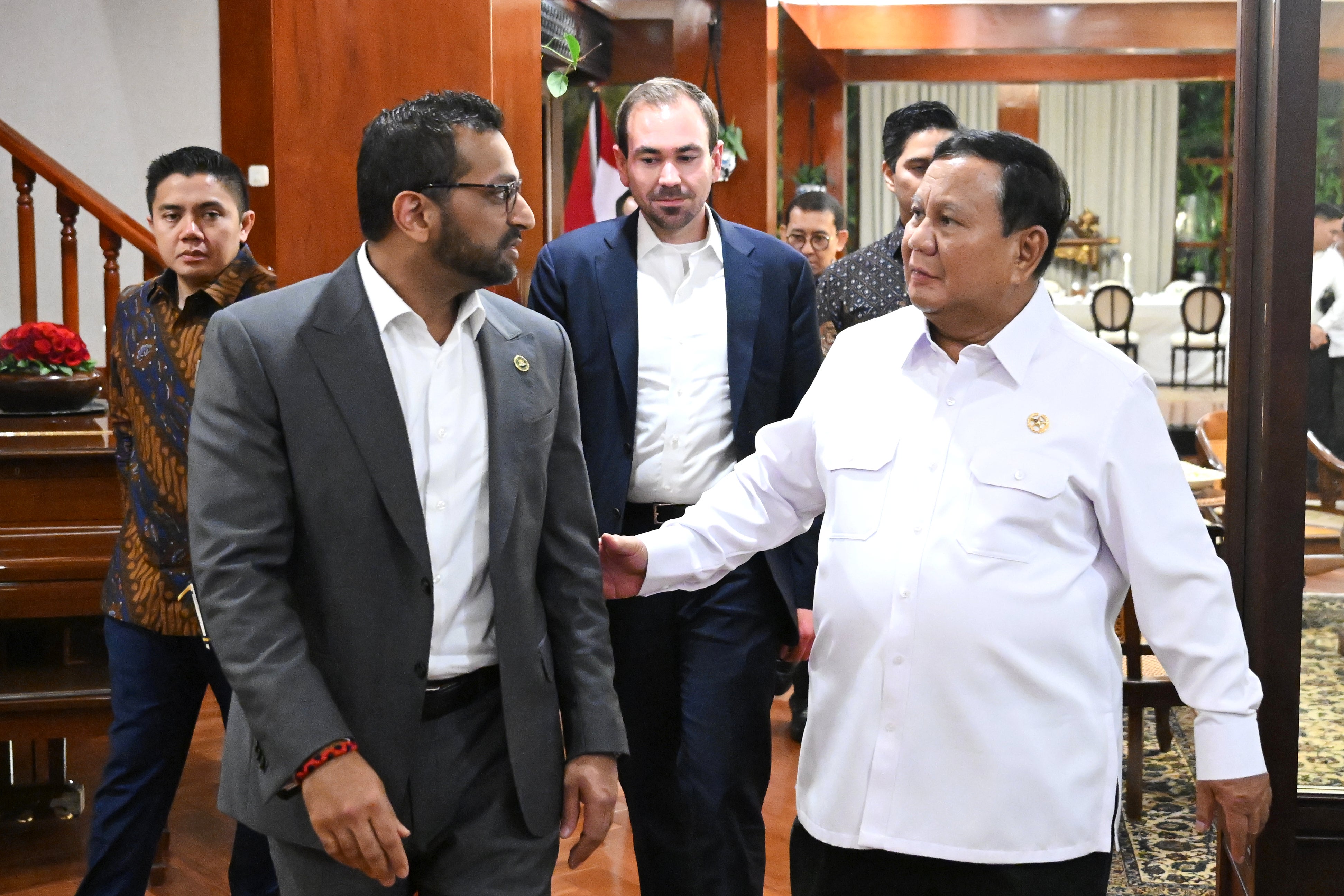 Indonesian President Prabowo Subianto, right, walks with FBI Director Kash Patel in Jakarta