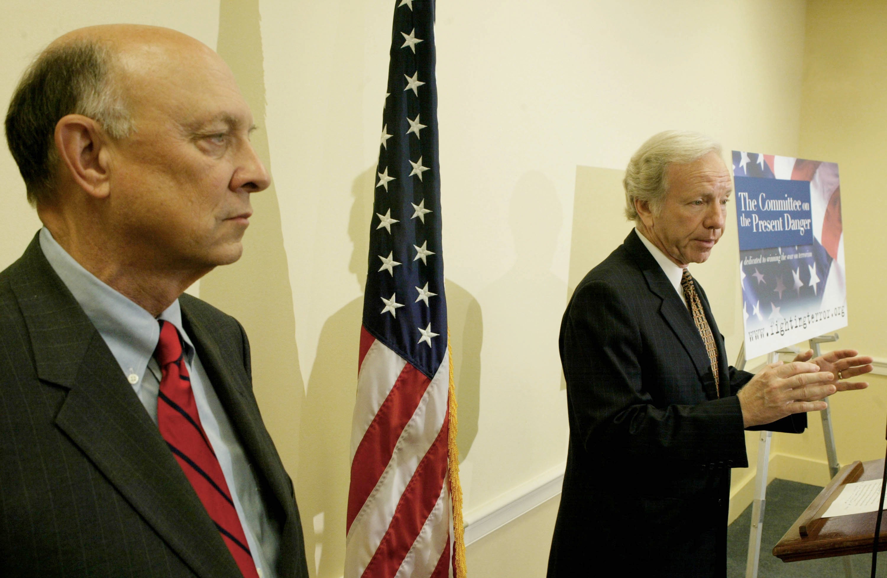 Senator Joe Lieberman (D-CT) (R) gestures while he speaks as Woolsey (L) listens on Capitol Hill July 20, 2004