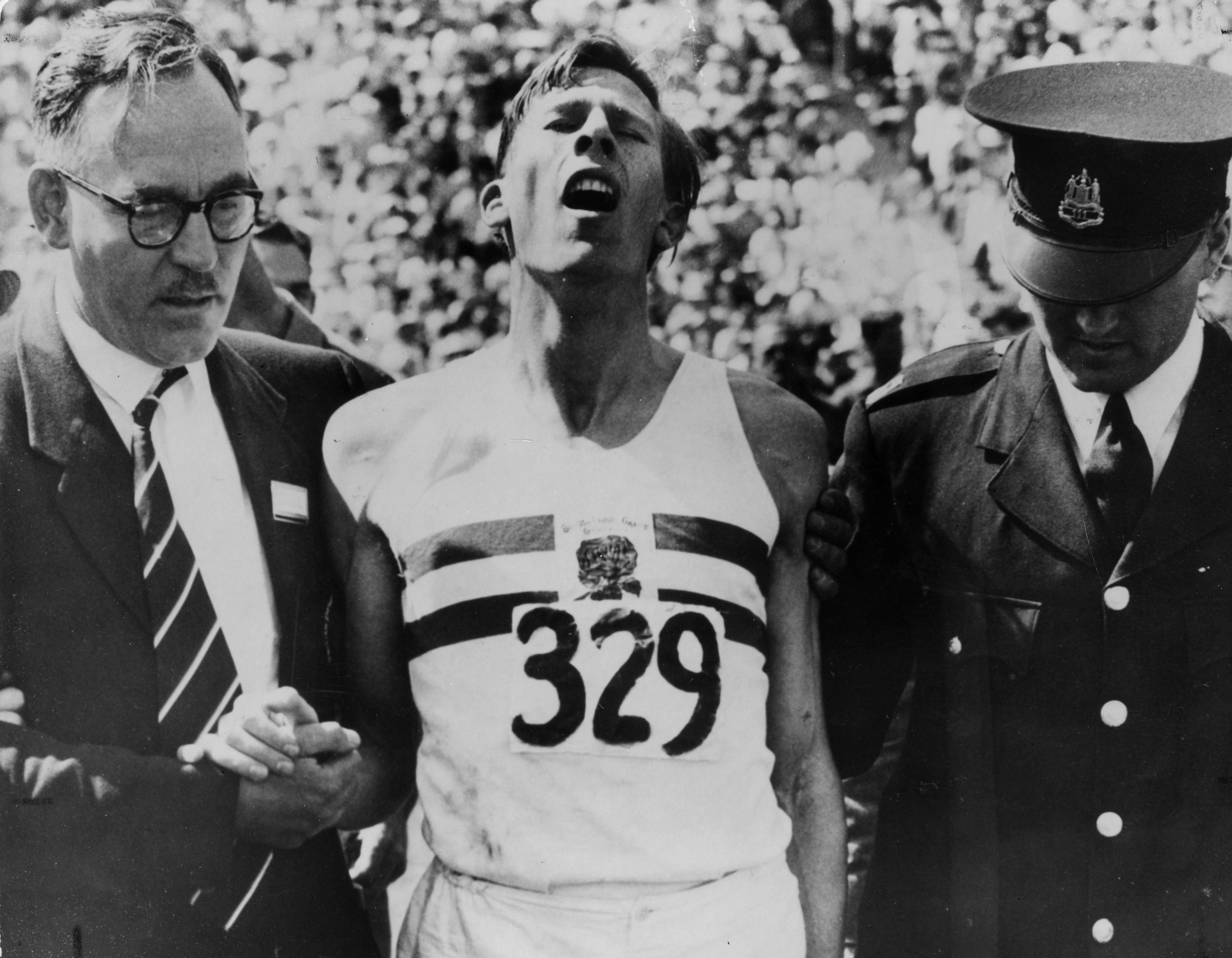 An exhausted Roger Bannister after beating John Landy in the Mircale Mile