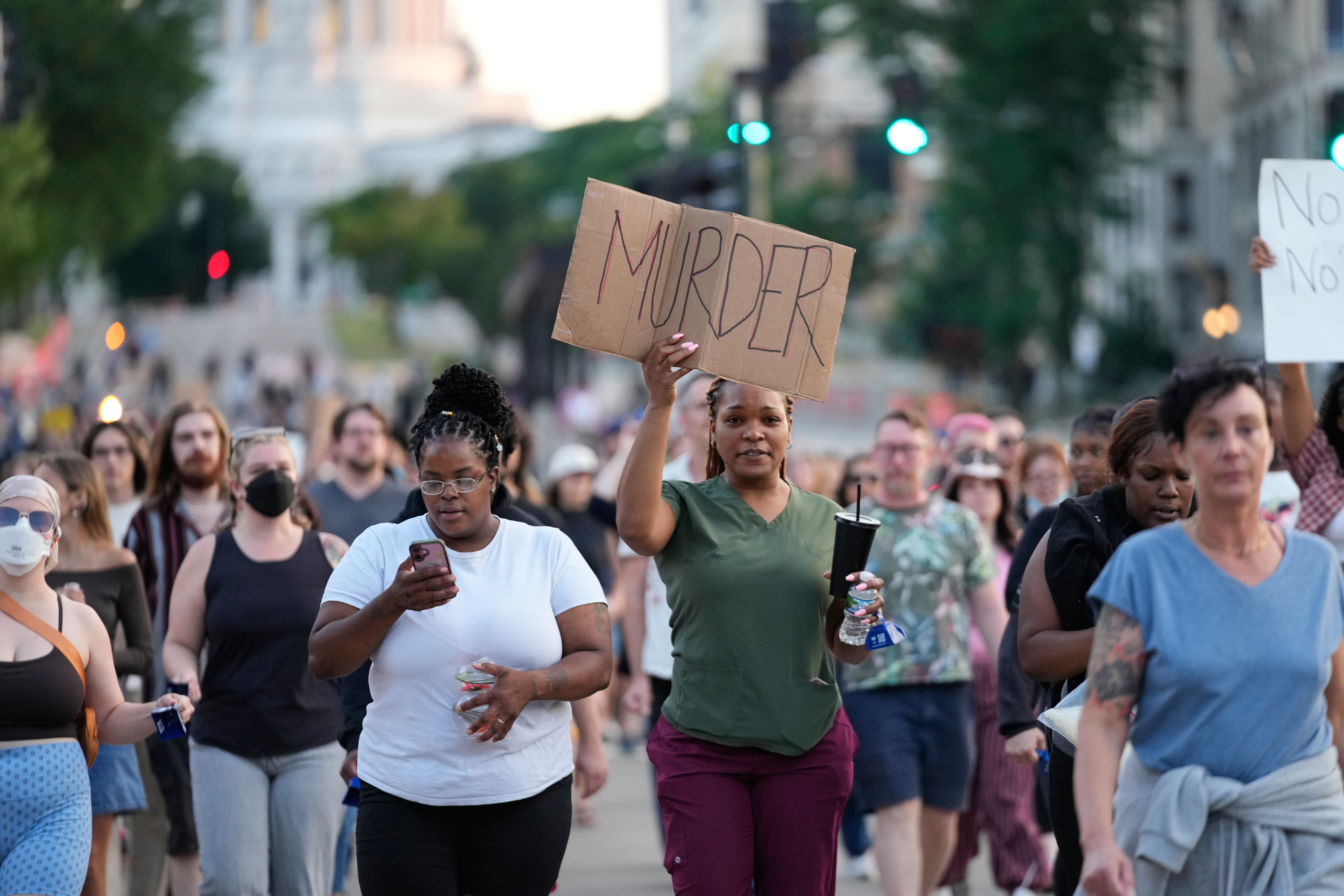 Protesters march after a police officer shot and killed a man Wednesday in Madison, Wisconsin