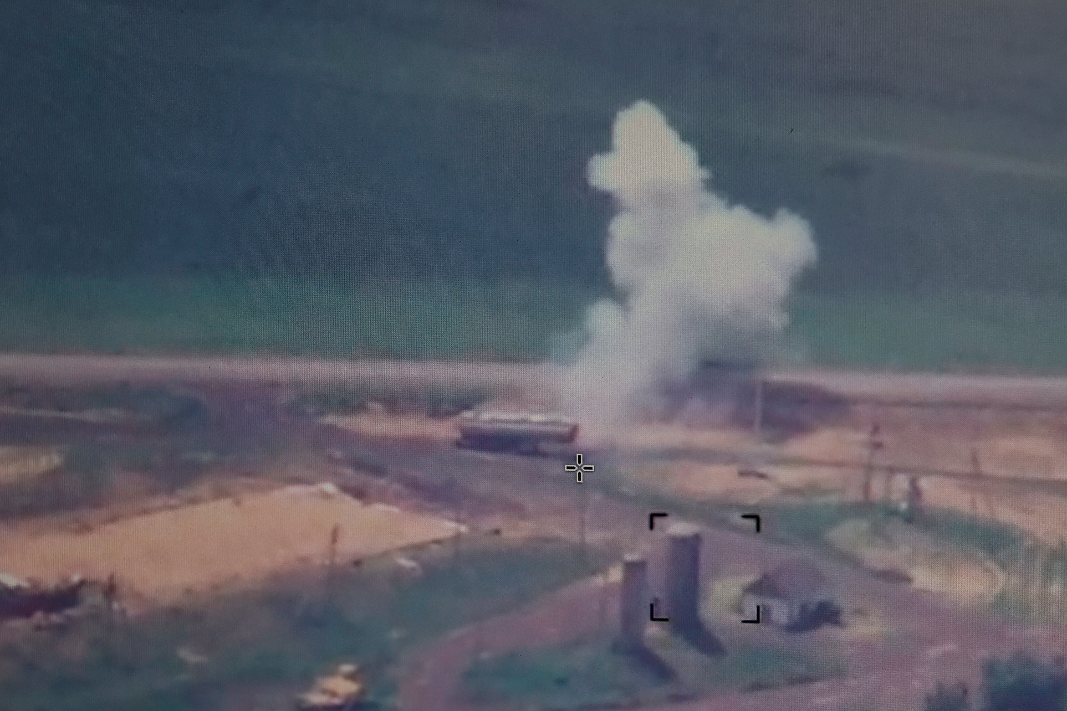 A live view in a monitor shows a Ukrainian strike of a drone towards a fuel tank in Crimea on 8 July (Reuters)