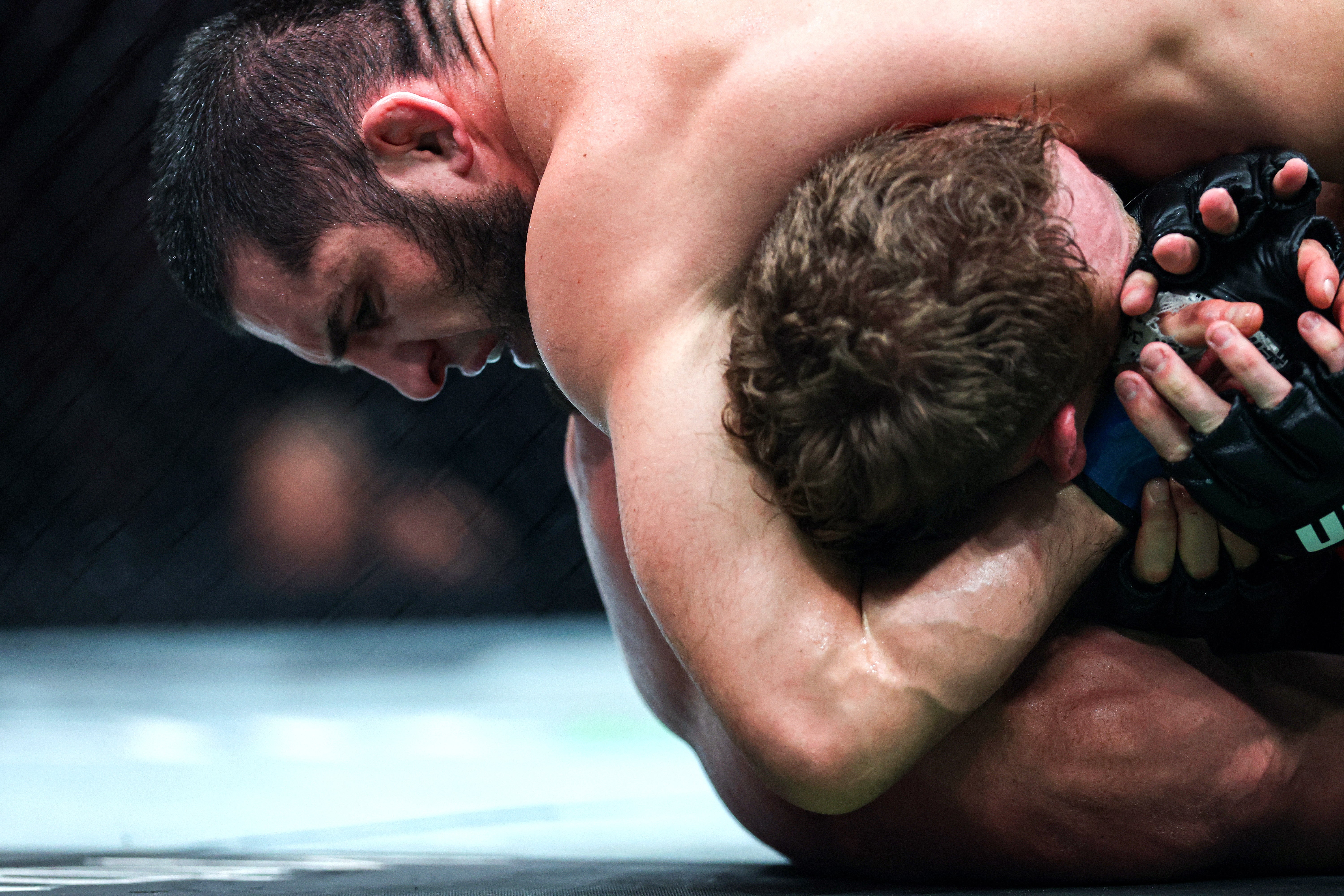 Islam Makhachev (left) during his title win over Jack Della Maddalena