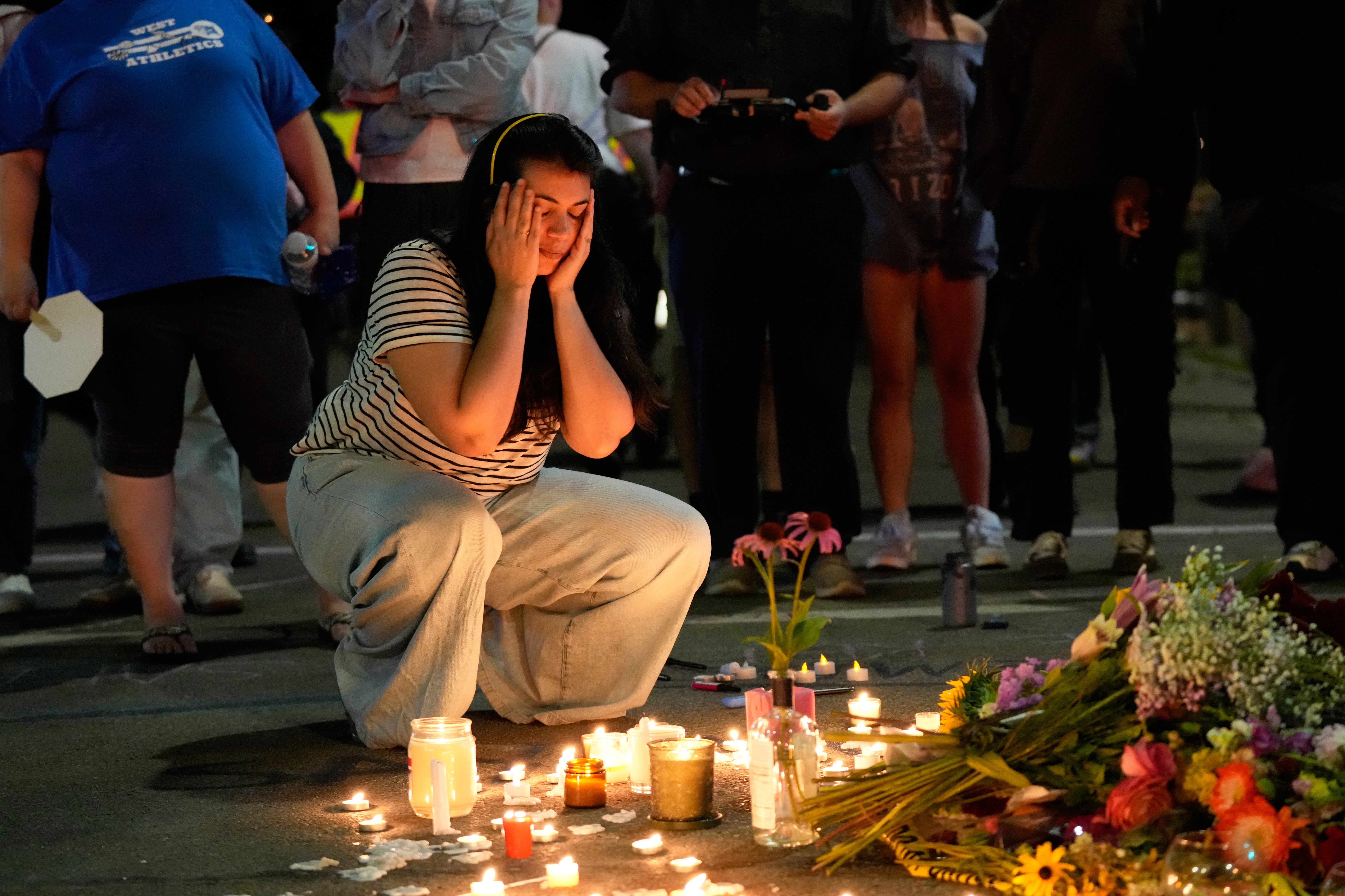 Hundreds of people took to the streets Wednesday evening to protest the killing and to hold a candlelight vigil in memory of the victim
