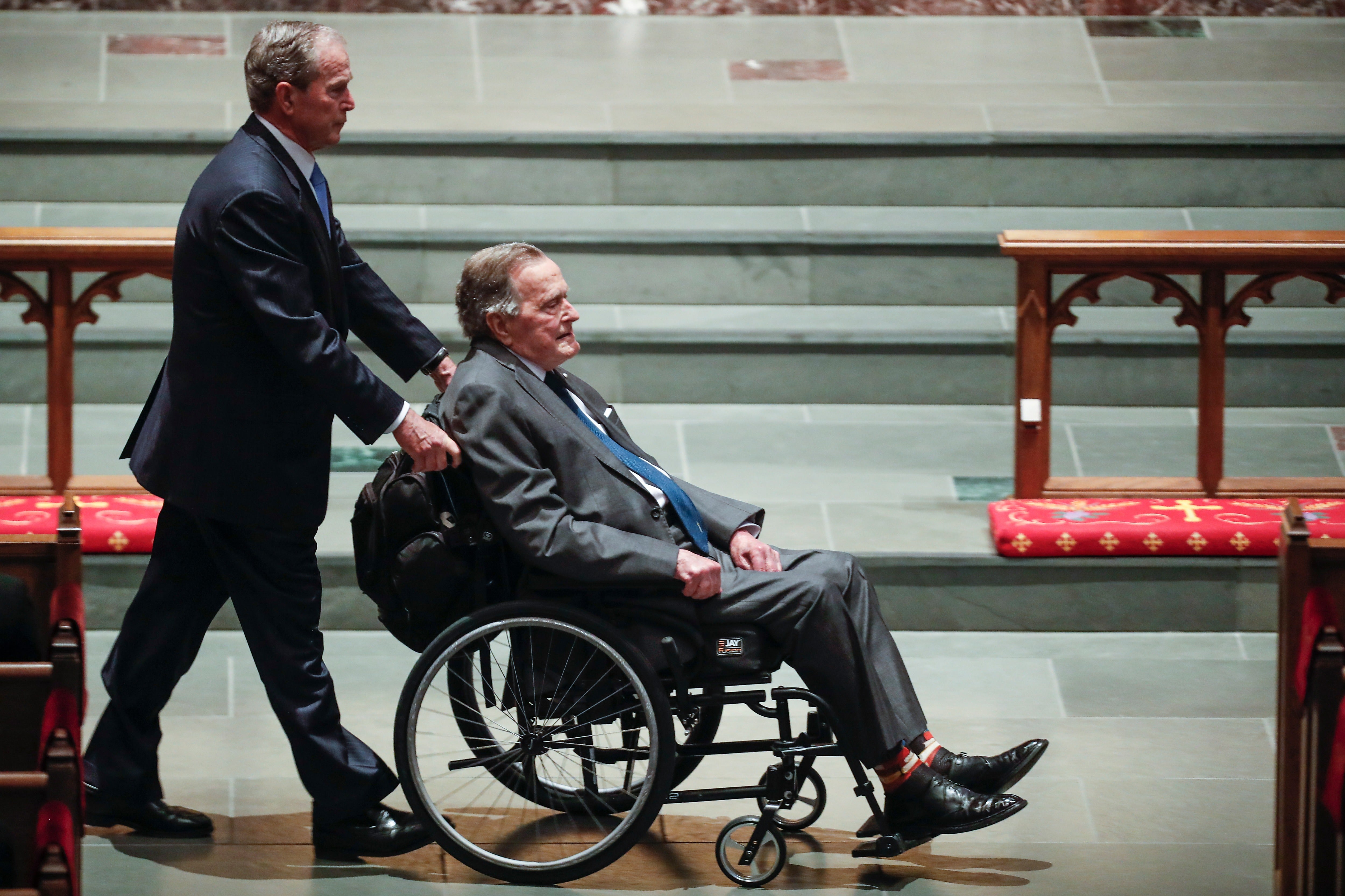 From the earliest days of the republic, America has embraced the concept of politics as a family business. Pictured: Former president George W. Bush, left, wheels his father, former president George H.W. Bush into the church for the funeral for former first lady Barbara Bush in 2018