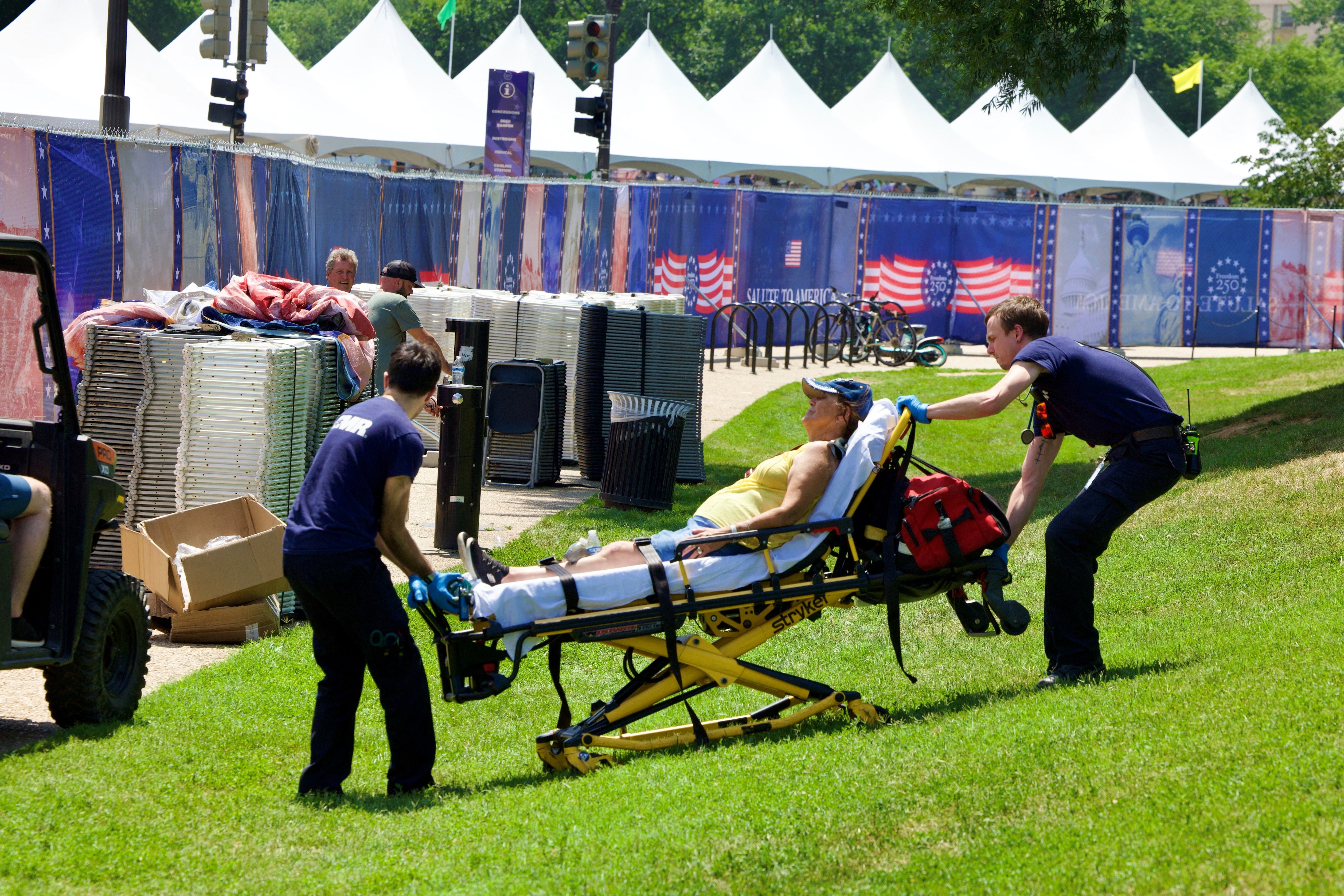 A person is helped by first responders at the National Mall in Washington, DC, during a heat dome earlier this month. Heat is the number one weather-related killer in the US
