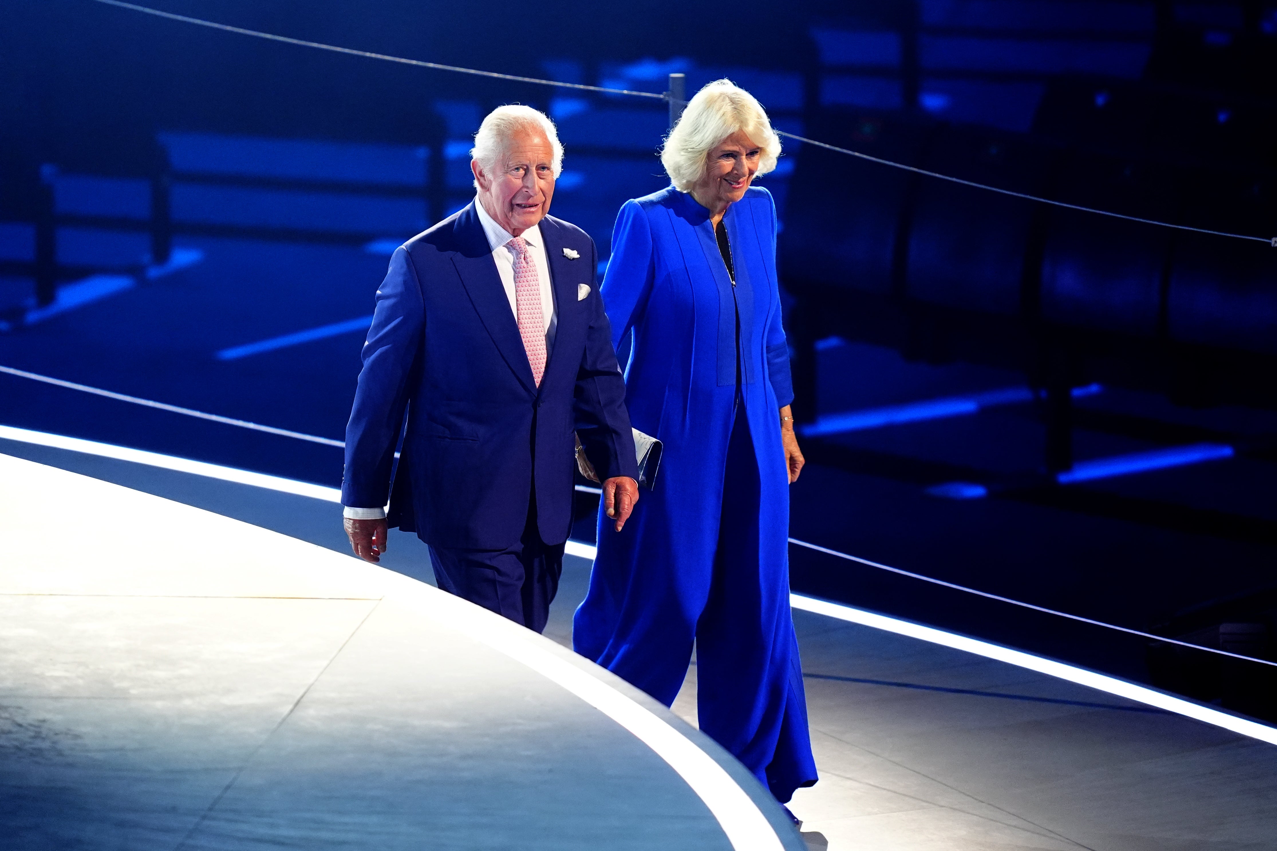 Charles and Camilla making their way down a ramp before taking up seats in the royal box (Jane Barlow/PA)