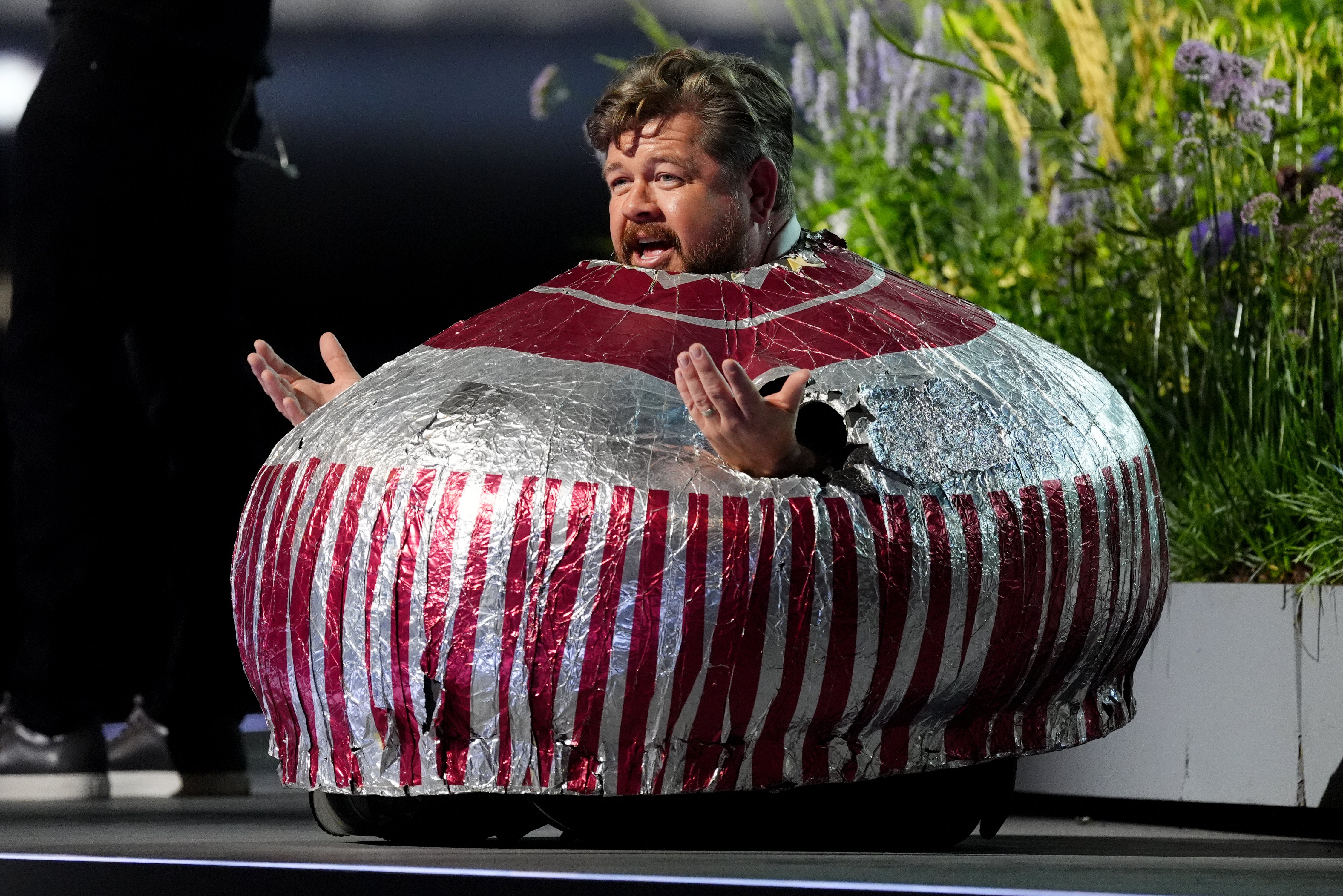 Actor and wrestler Grado dressed as a giant Tunnock’s Tea Cake during the pre-ceremony show (Andrew Milligan/PA)