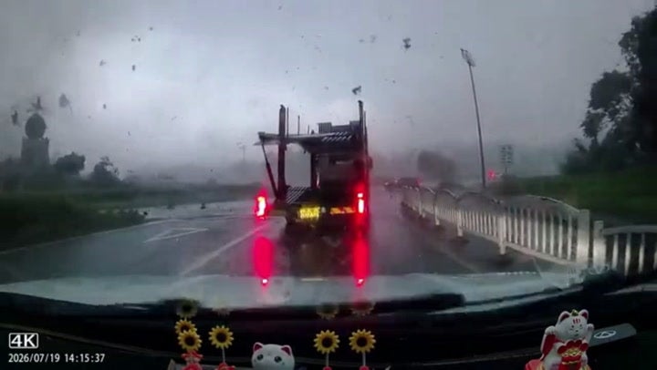 Terrifying moment car hurled into the air by tornado crossing highway
