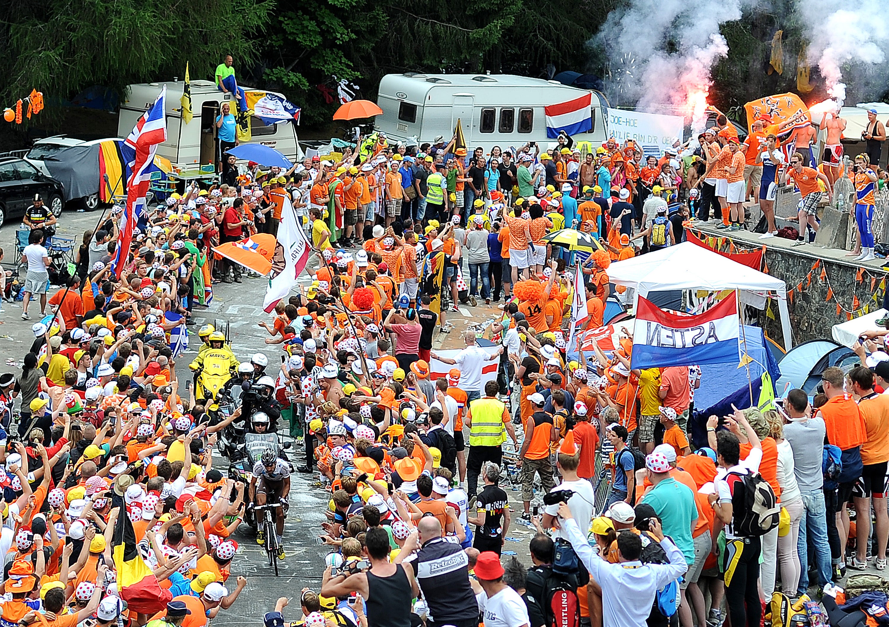 Fans flood Alpe d'Huez when the Tour de France visits, including at 
