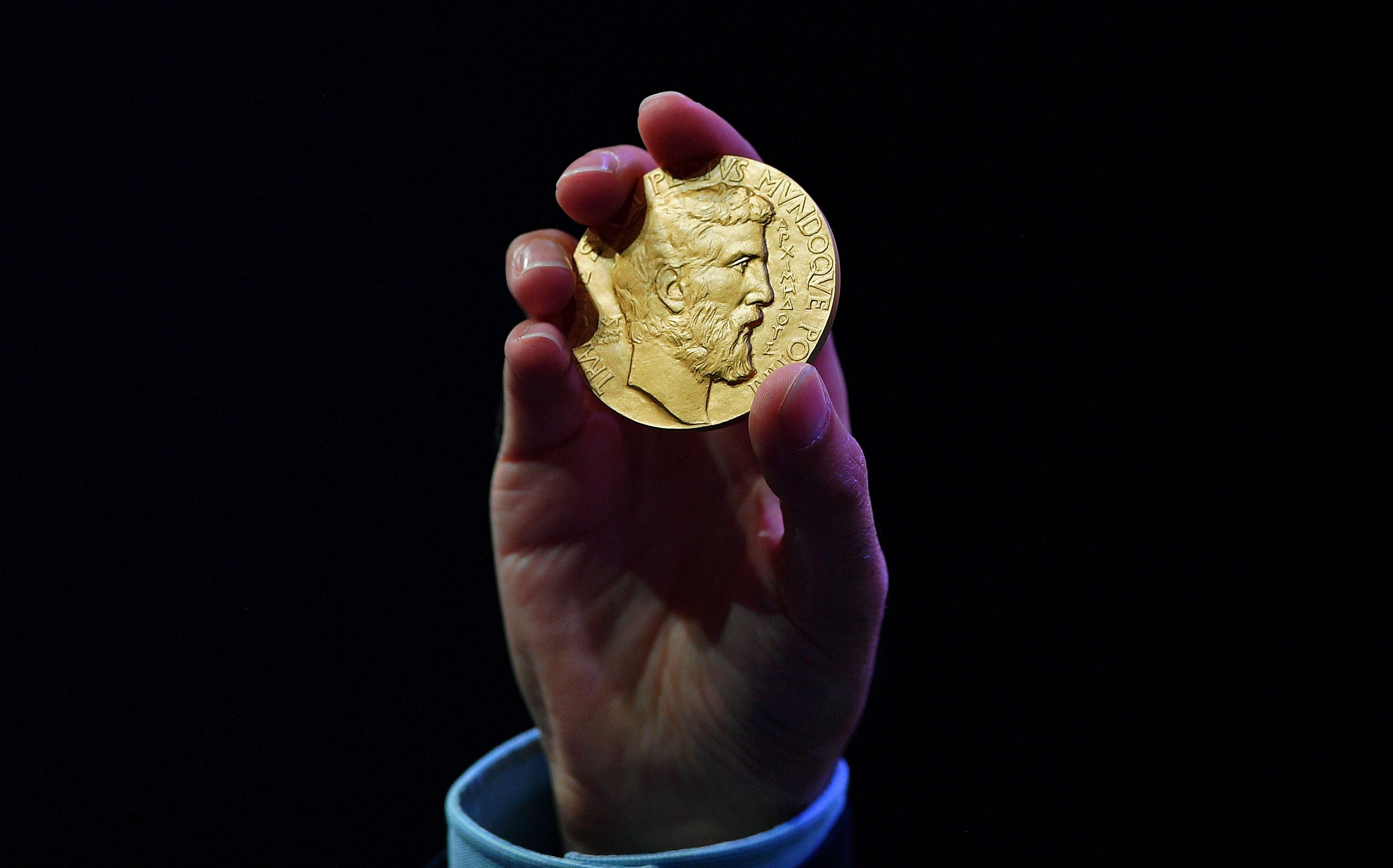 Gold coin with the face of Archimedes, an ancient Greek mathematician