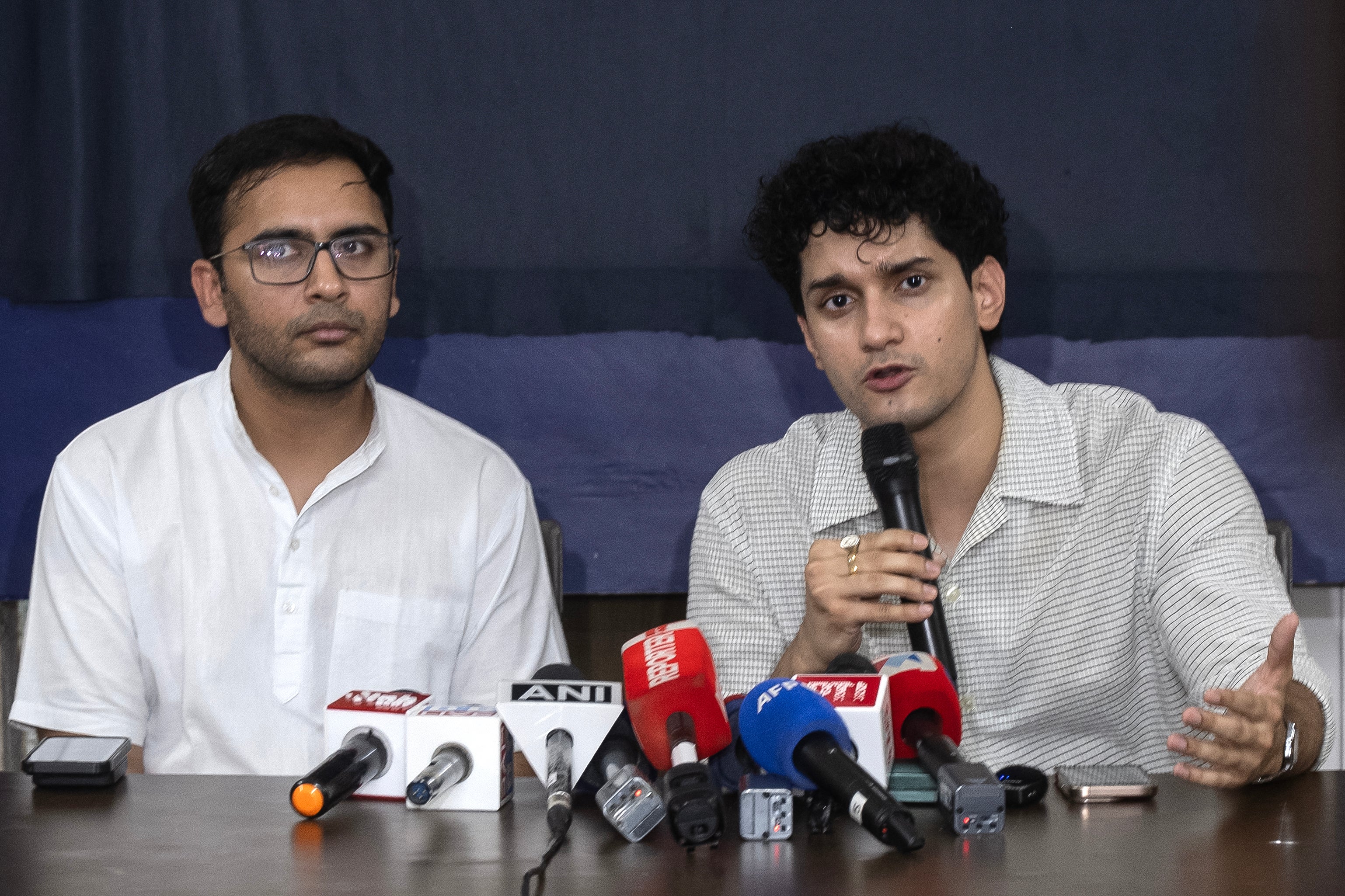India's Cockroach Janta Party spokespersons Saurav Das and Ashutosh Ranka address the media in Delhi